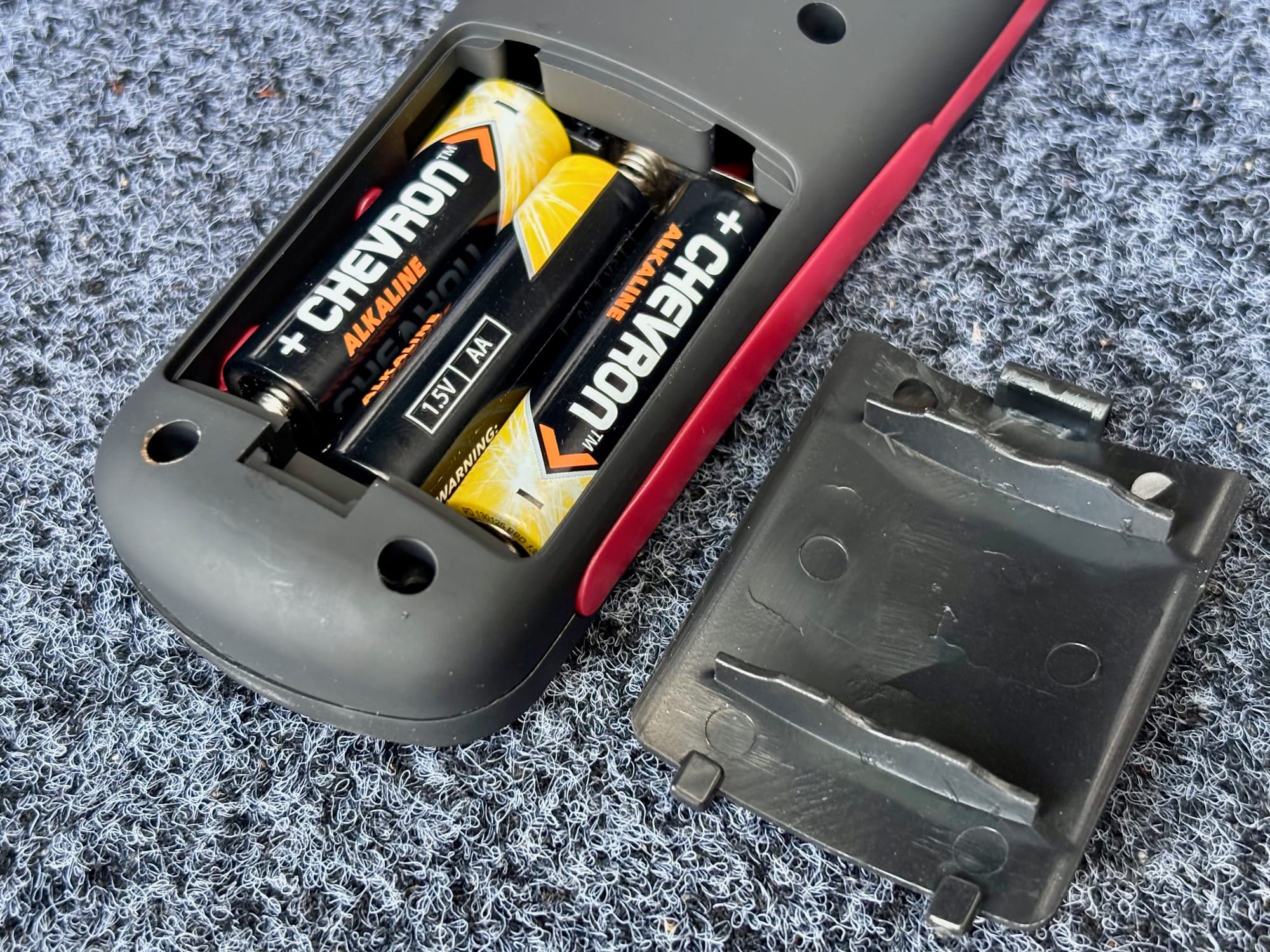 Three AA batteries in the back of the Adventure Kings Illuminator LED work light