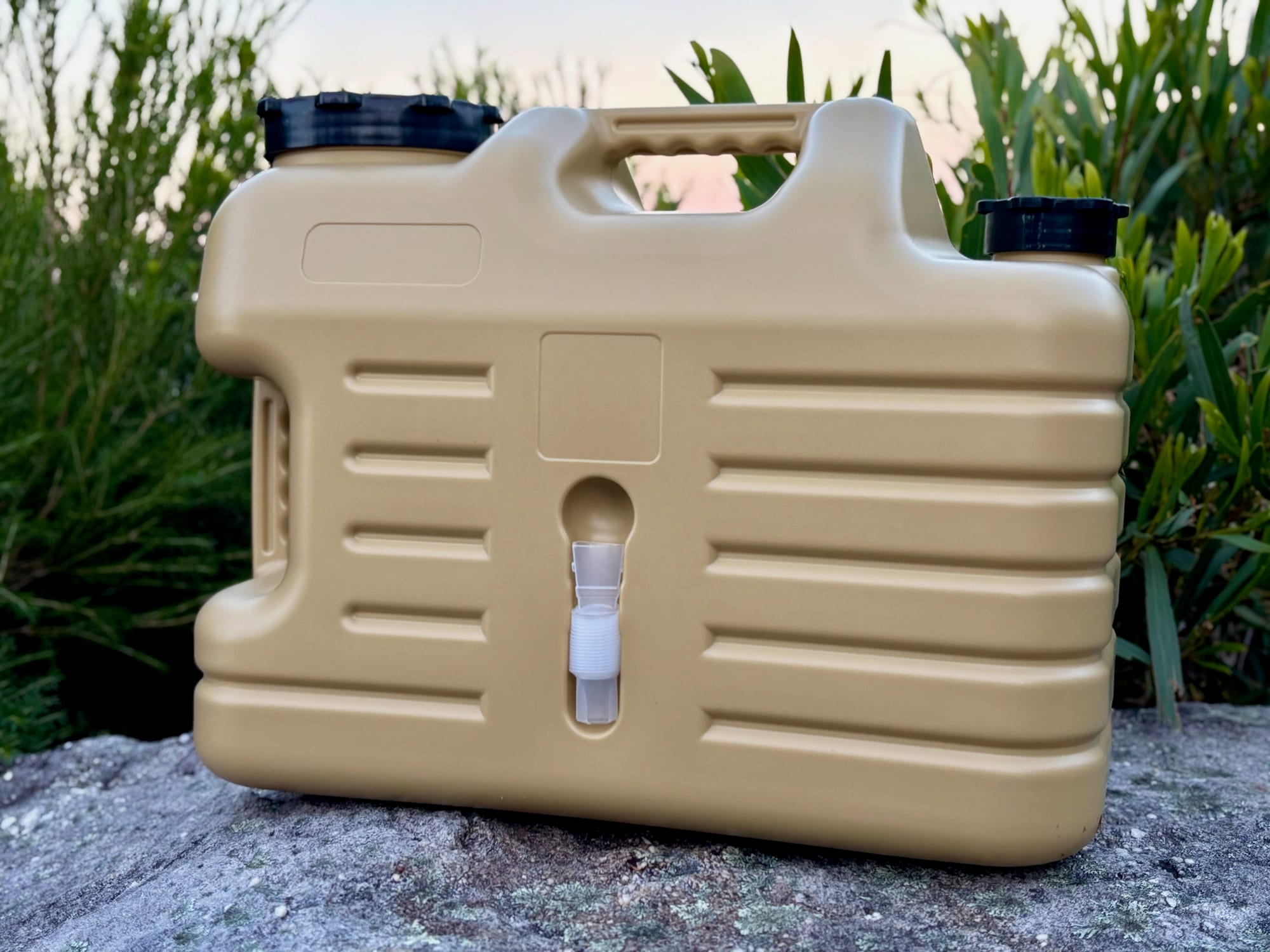 The Aimall 18.5L container from the side, showing the ribbed body, the slot for the tap extension tube, the lid and the handle