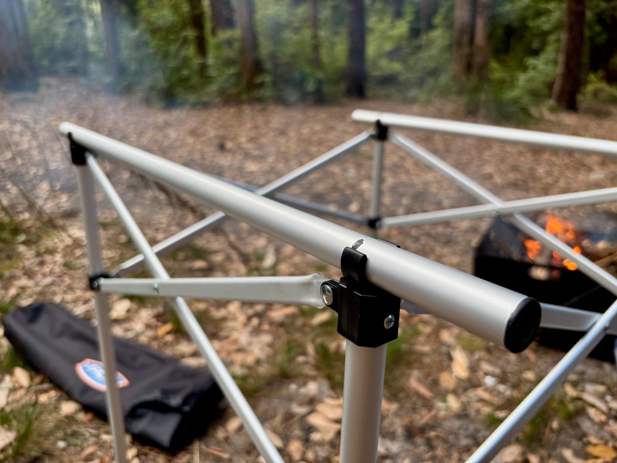 A cross bar clipped into the frame of the BCF roll up table, with a marker line showing where the hole is