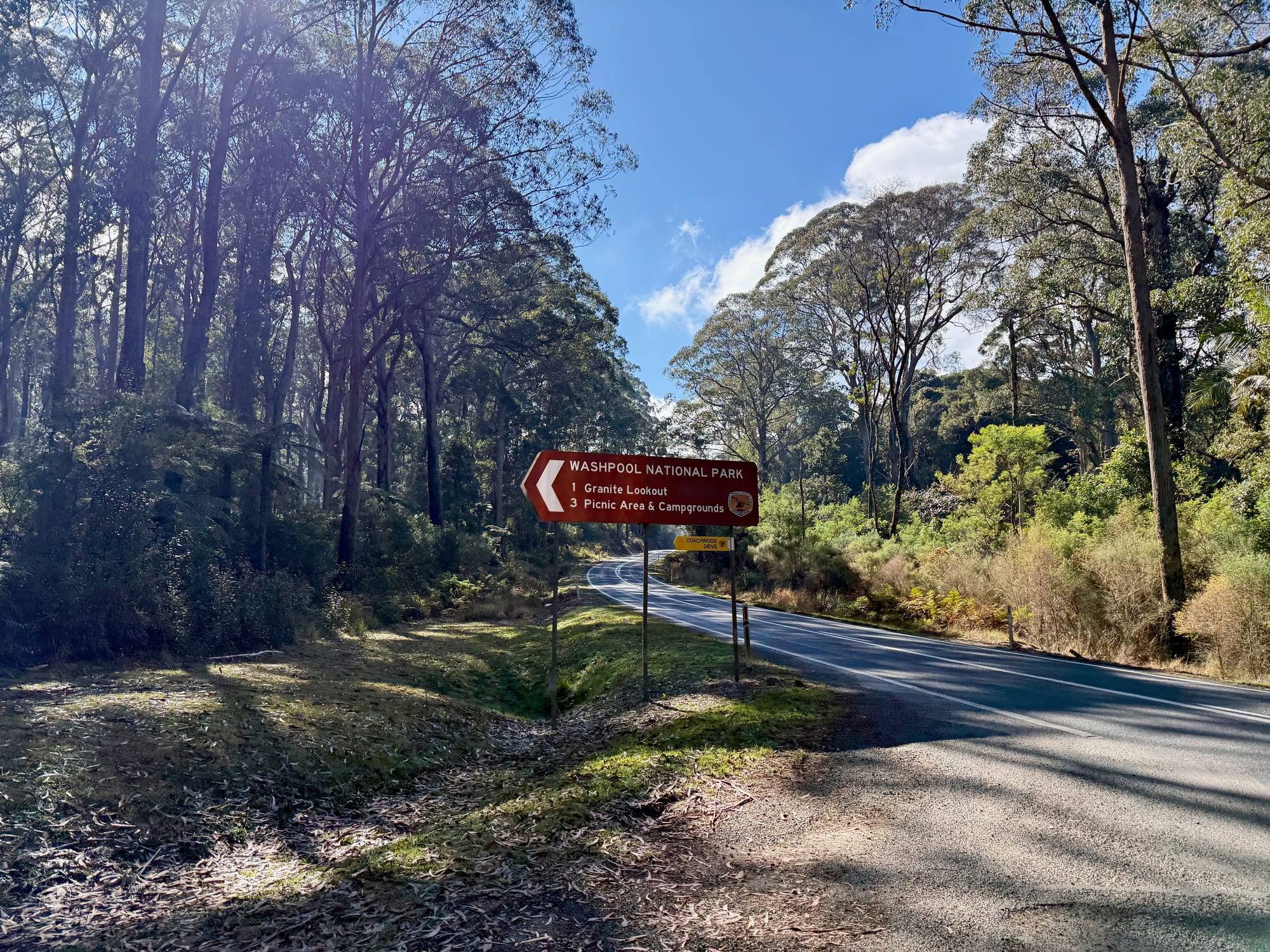 The brown Washpool National Park sign on the Gwydir Highway, pointing to a lookout, the picnic area and campgrounds