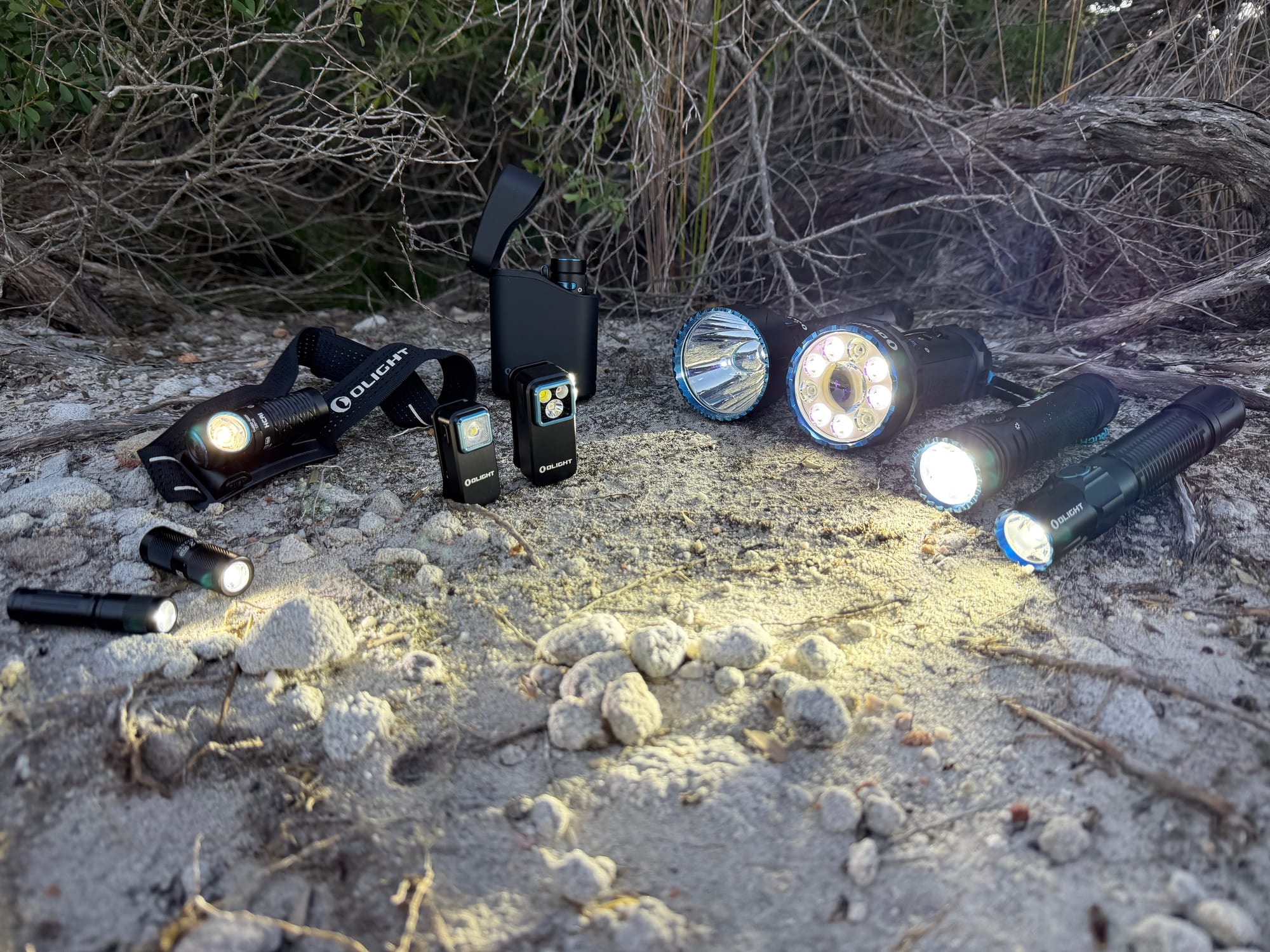 Our Olight torches switched on at dusk on a sandy track