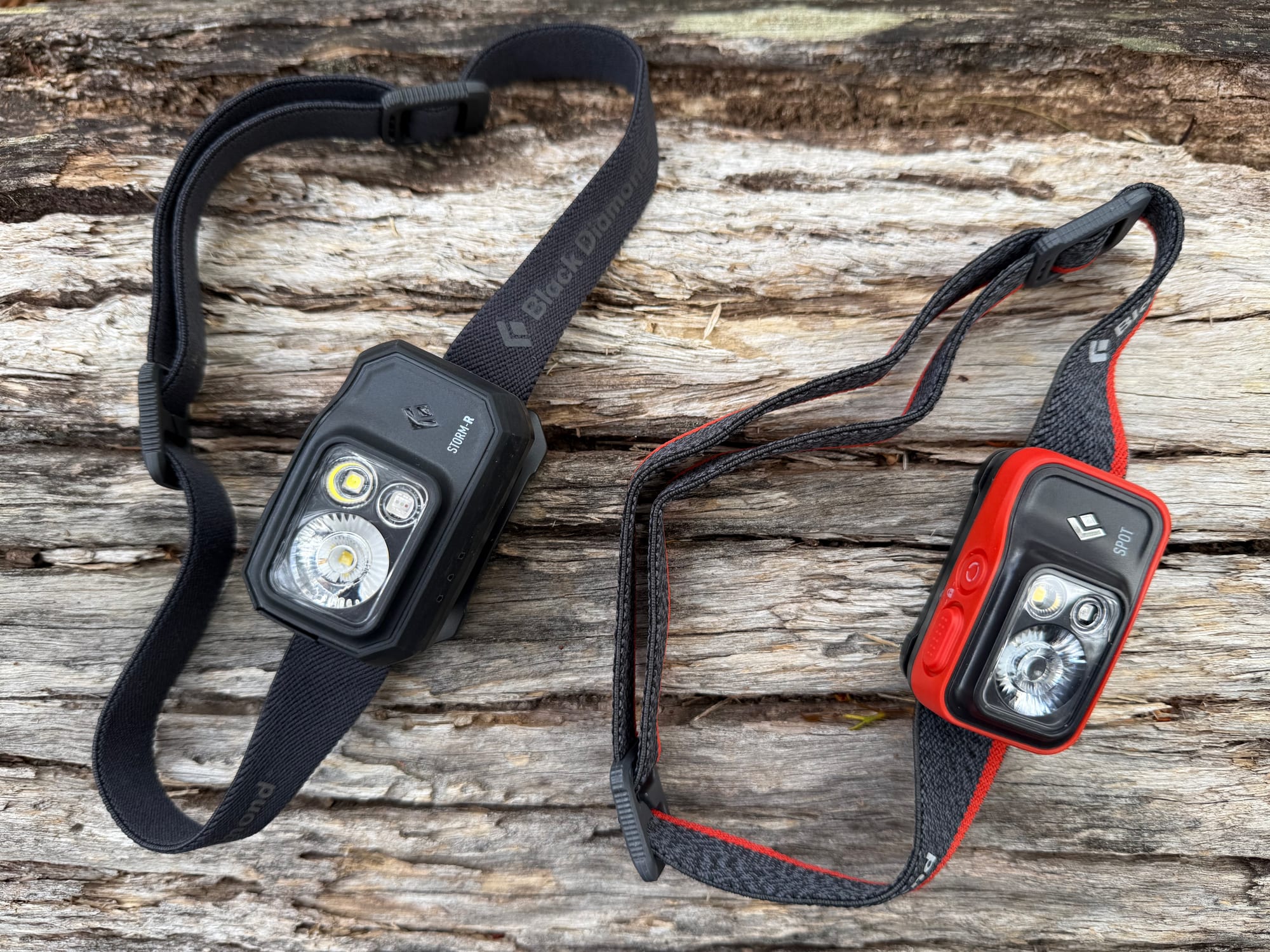 The Storm 500-R and the Spot 400 laid out side by side on a log, seen from above