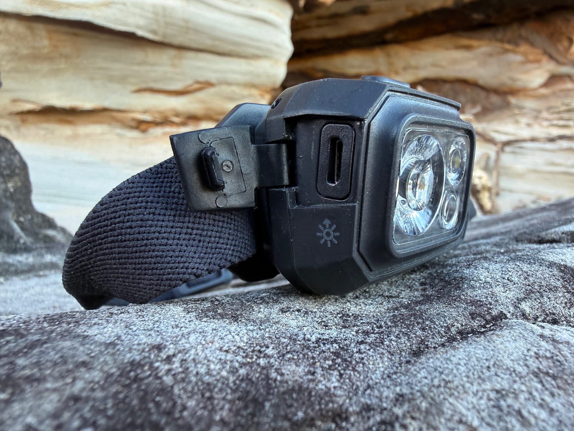 The micro-USB port beside the lens of the Storm 500-R, with the Power Tap icon on the side