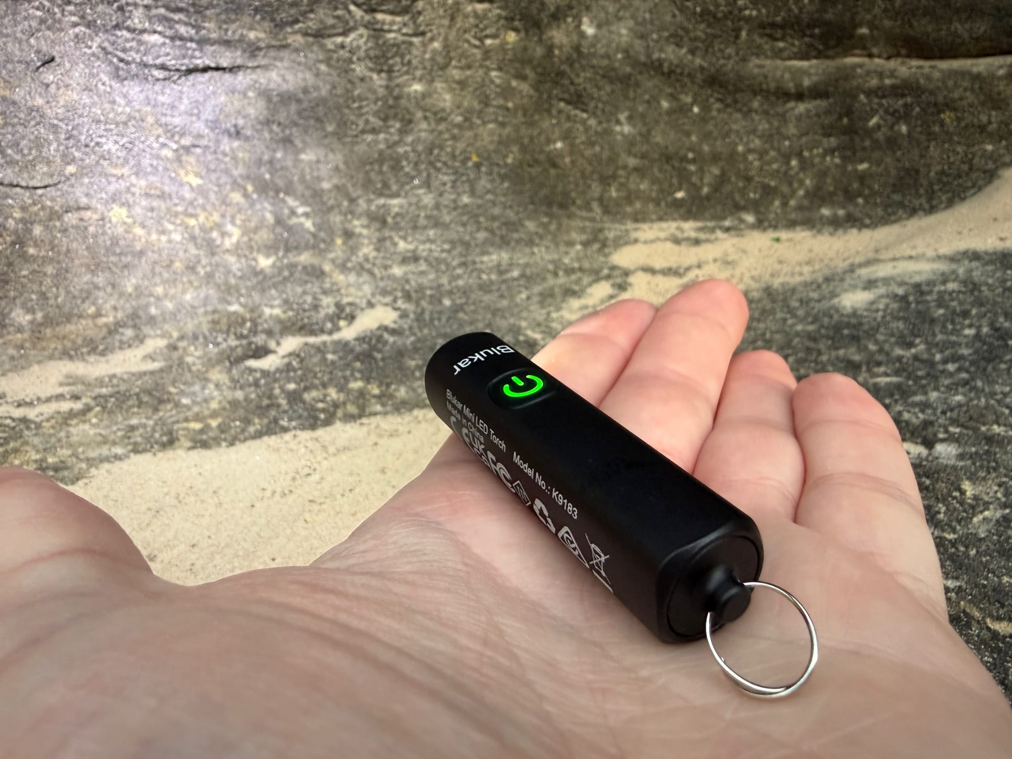 The Blukar Mini Torch in the palm of a hand