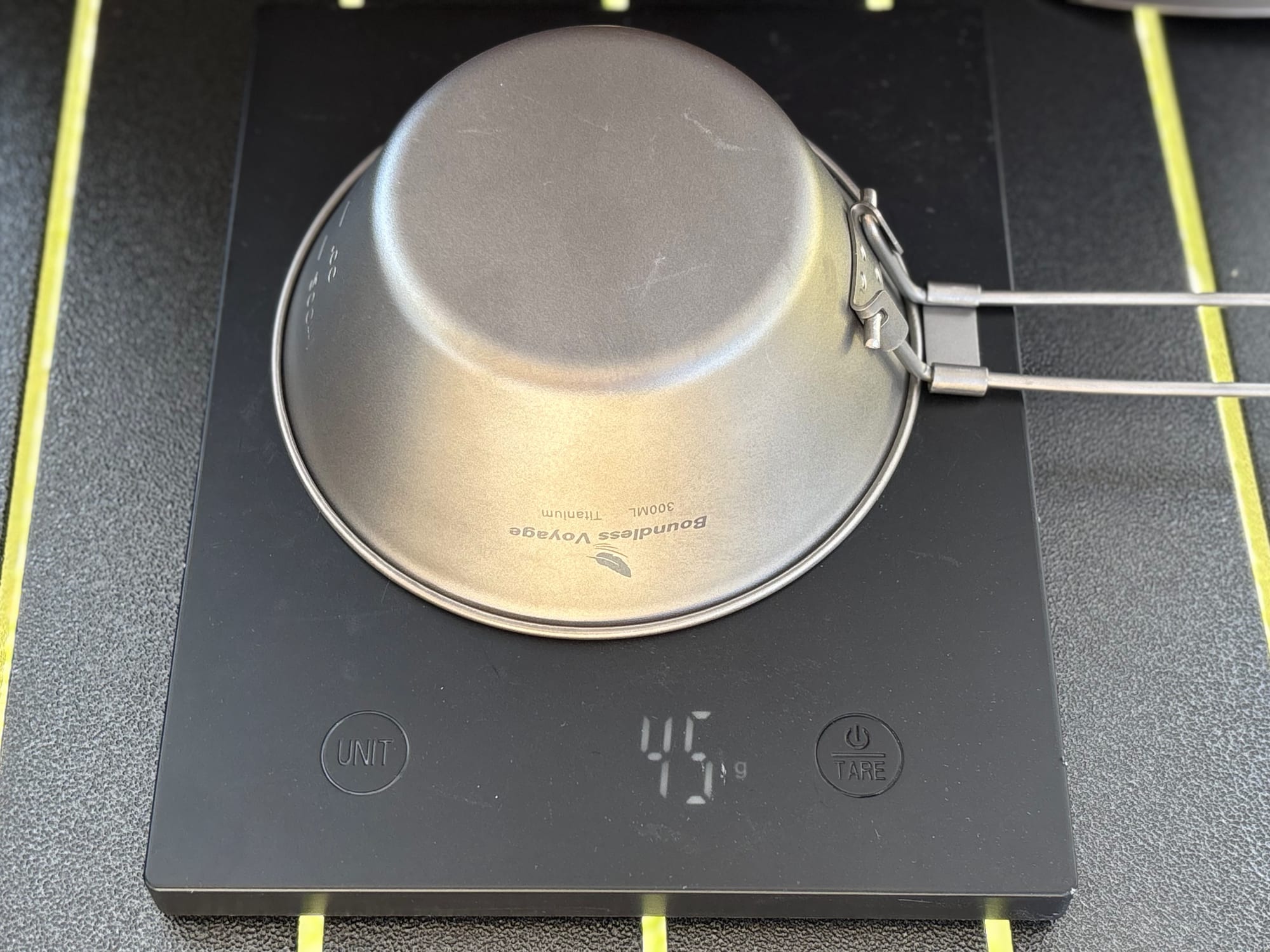 The 300 ml titanium bowl upside down on a kitchen scale showing 45 g