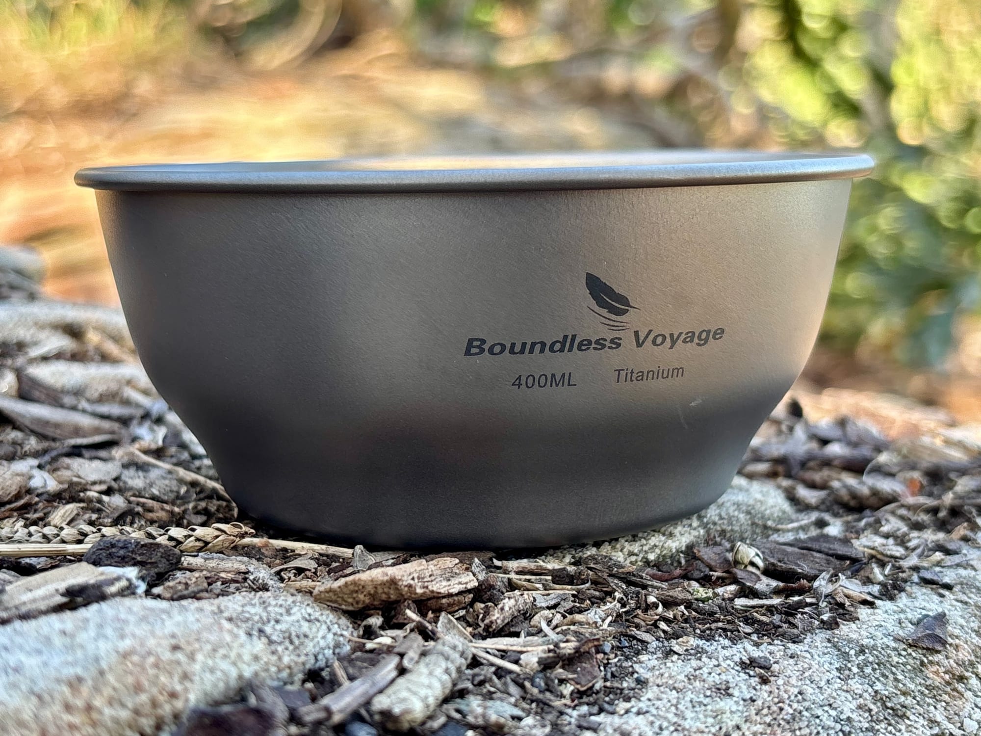 The 400 ml titanium bowl from the side, with the Boundless Voyage 400ML Titanium marking