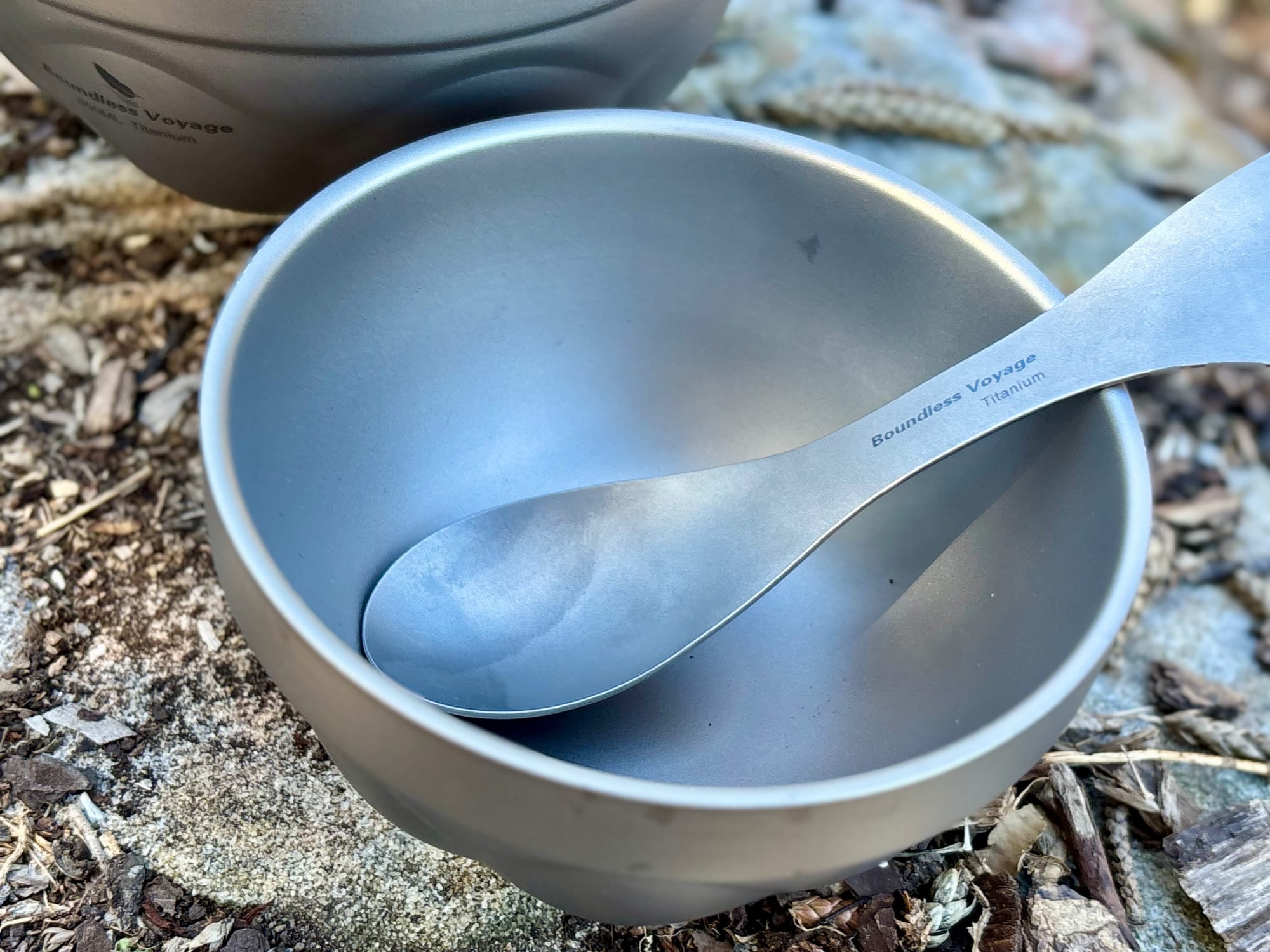 The inside of the titanium bowl with a titanium spork resting in it