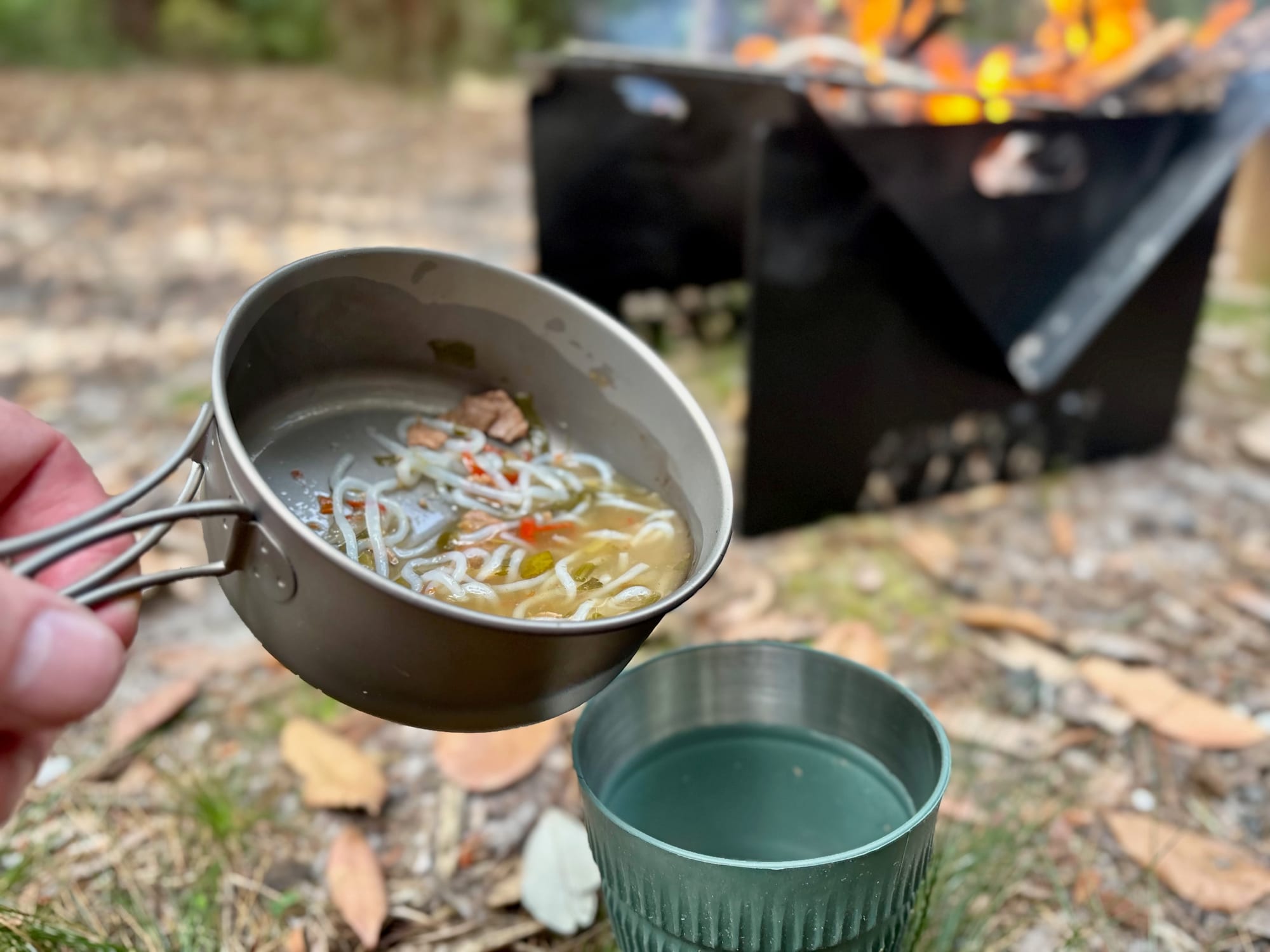 Pouring soup from the titanium pan into a mug