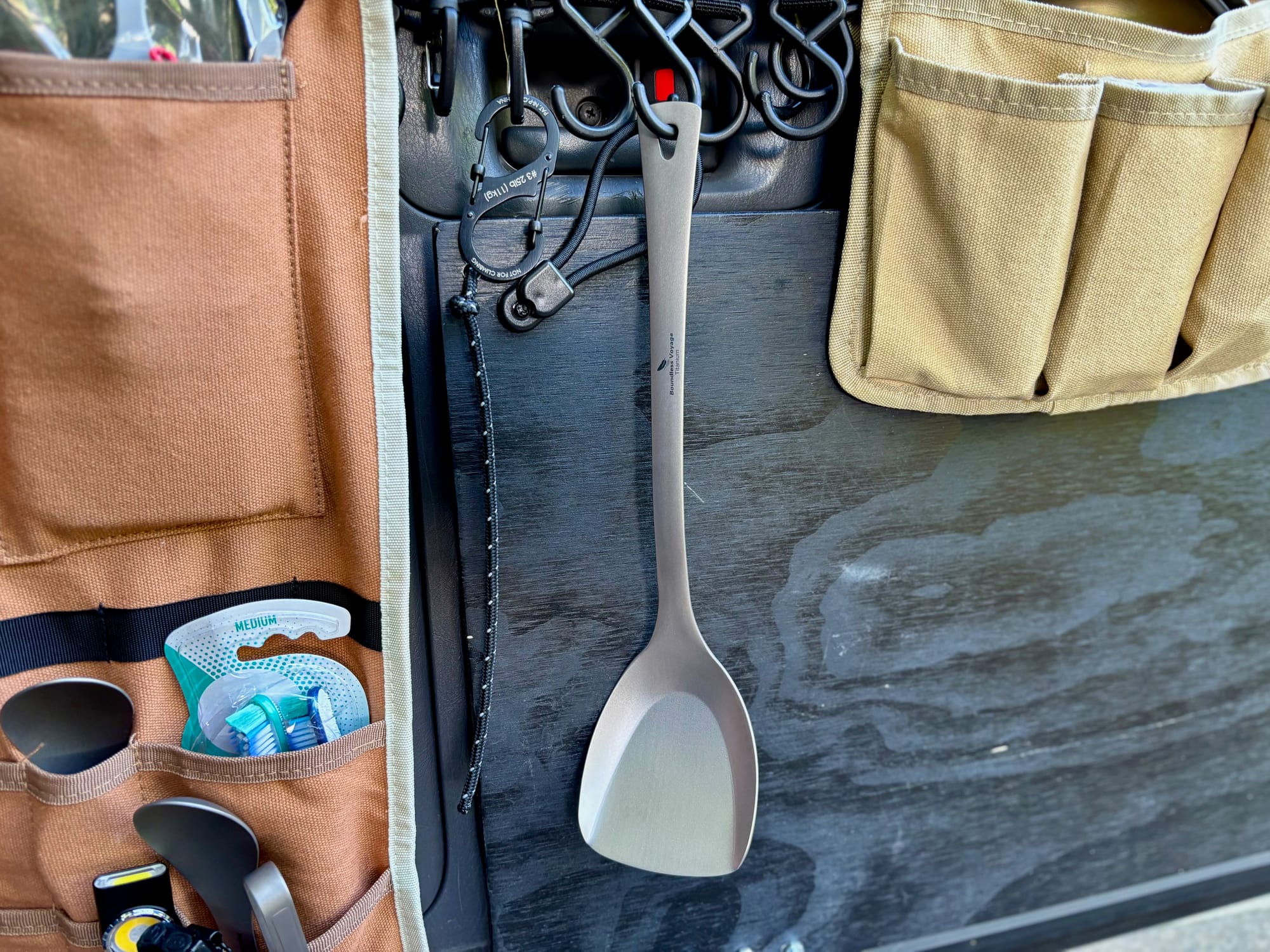 The Ti1073T spatula hanging from the kitchen organiser in the back of our car