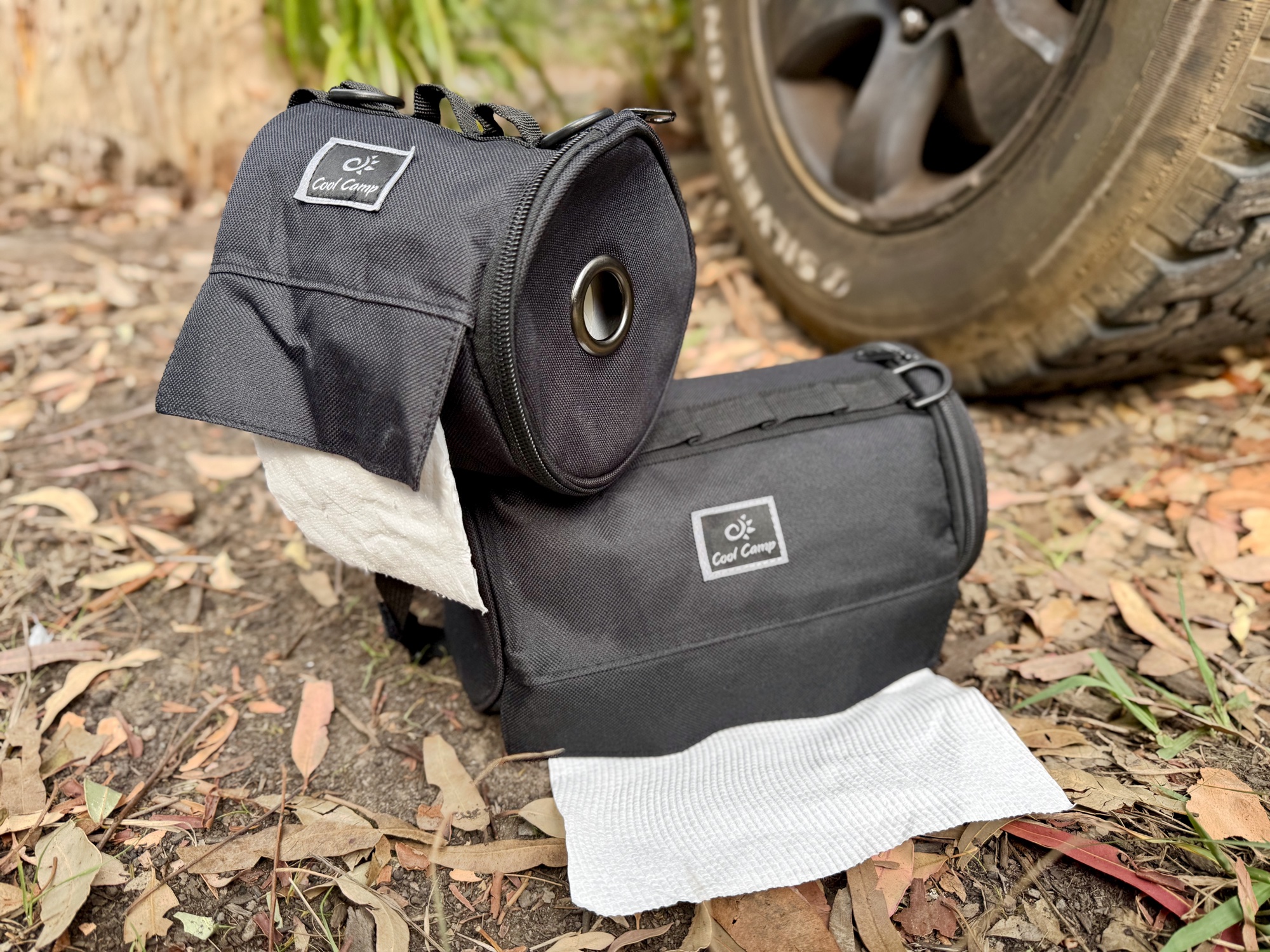 The toilet roll holder sitting on the matching paper towel holder next to the 4WD