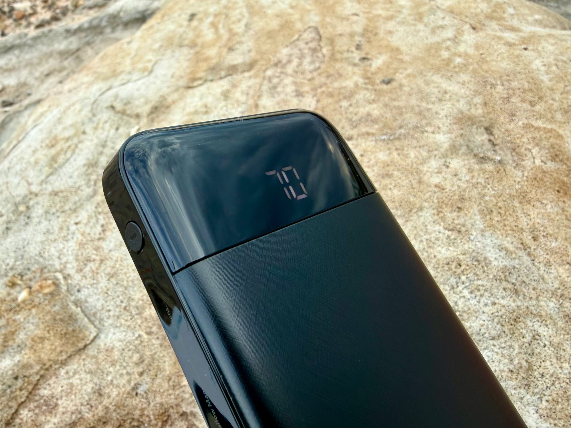 The display of the Charmast power bank showing 70 percent