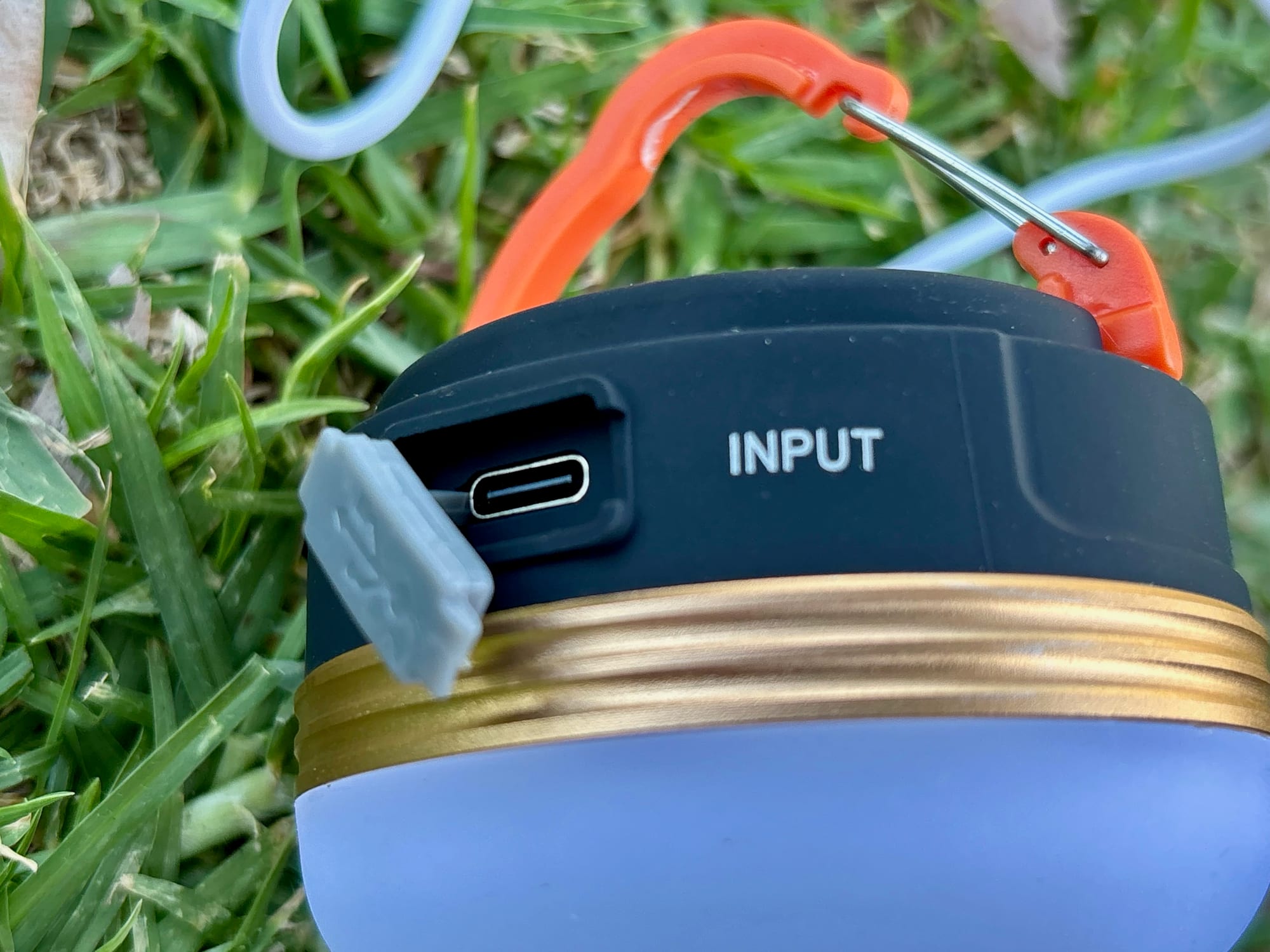 Close-up of the USB-C input port on the Clearhill lantern with its rubber flap open