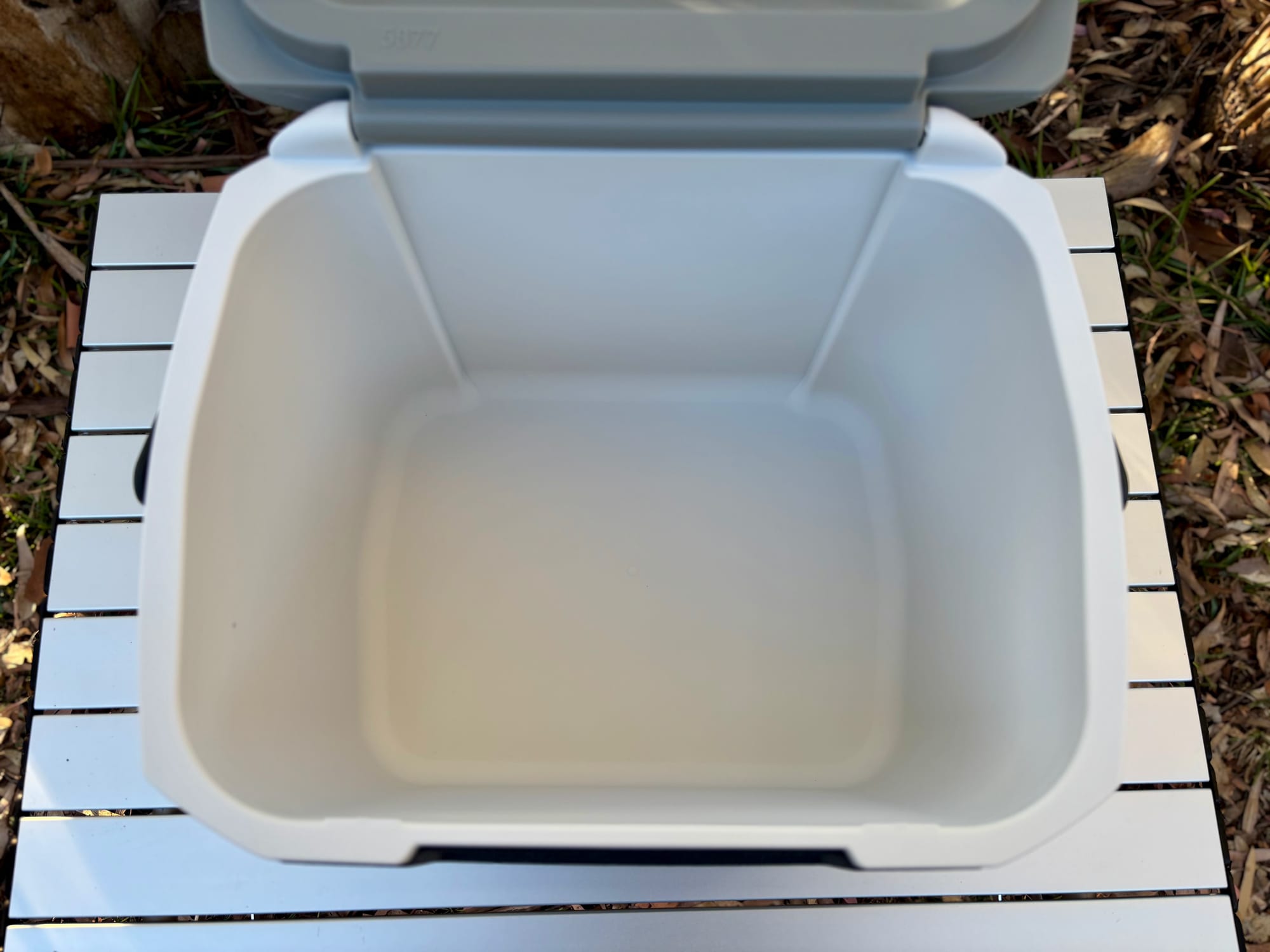 The plain white inside of the Coleman 15L hard cooler