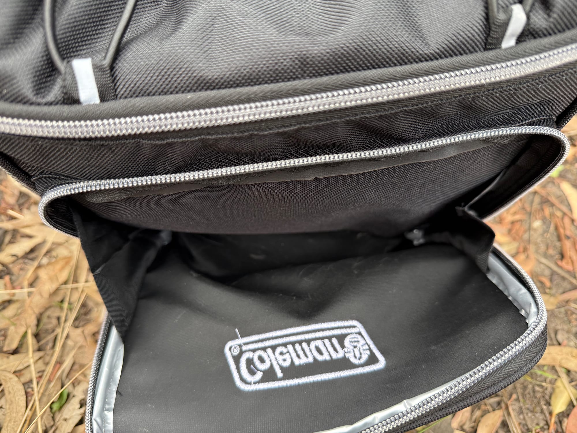 The zipped front pocket of the Coleman 30 Can Soft Cooler