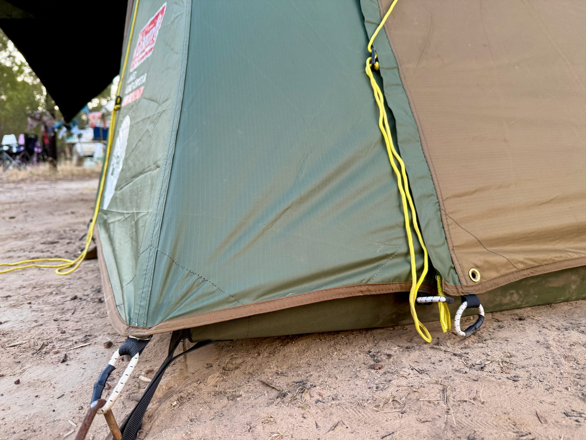 A pegged corner and a yellow guy rope on the Coleman Northstar tent