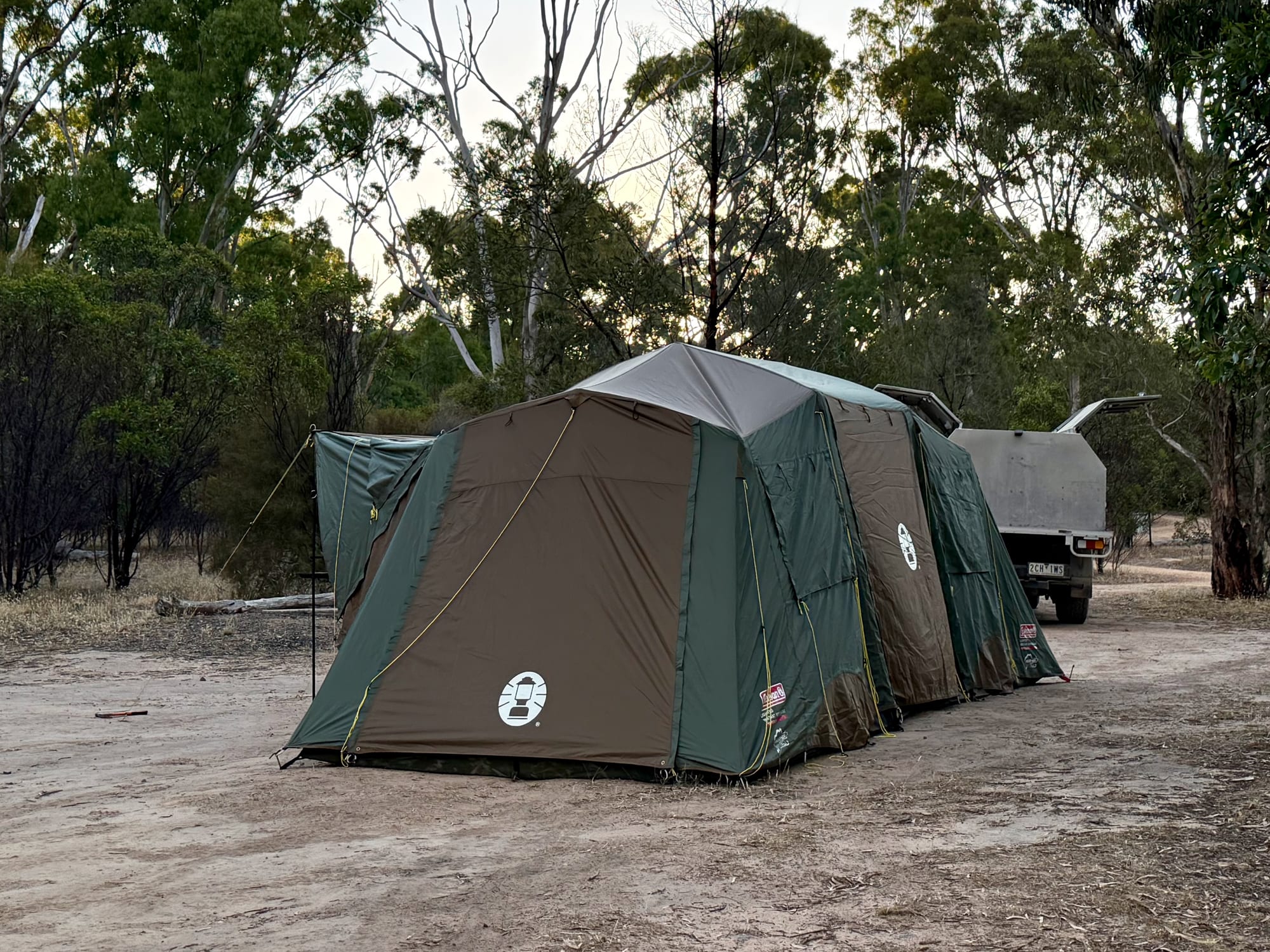 Our friends’ Coleman Northstar 10 Person tent next to their ute at camp, showing how big it is