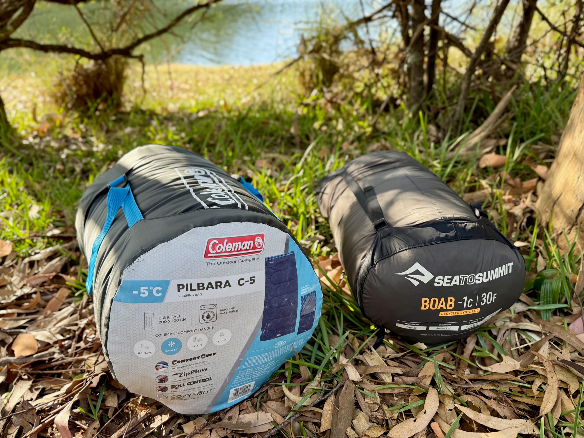 The packed Coleman Pilbara C-5 next to a packed Sea to Summit Boab sleeping bag