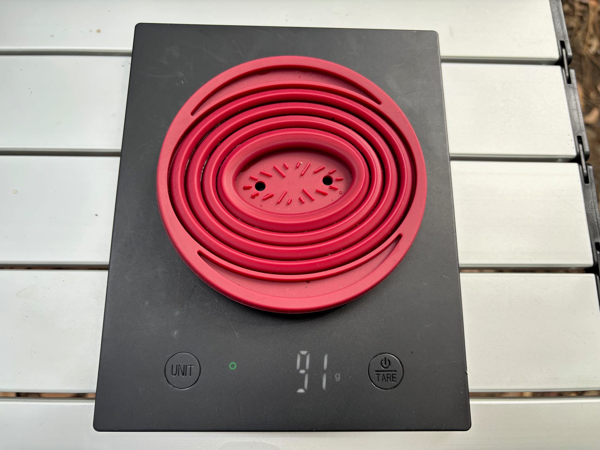 One collapsible coffee dripper on the scale at 91 g