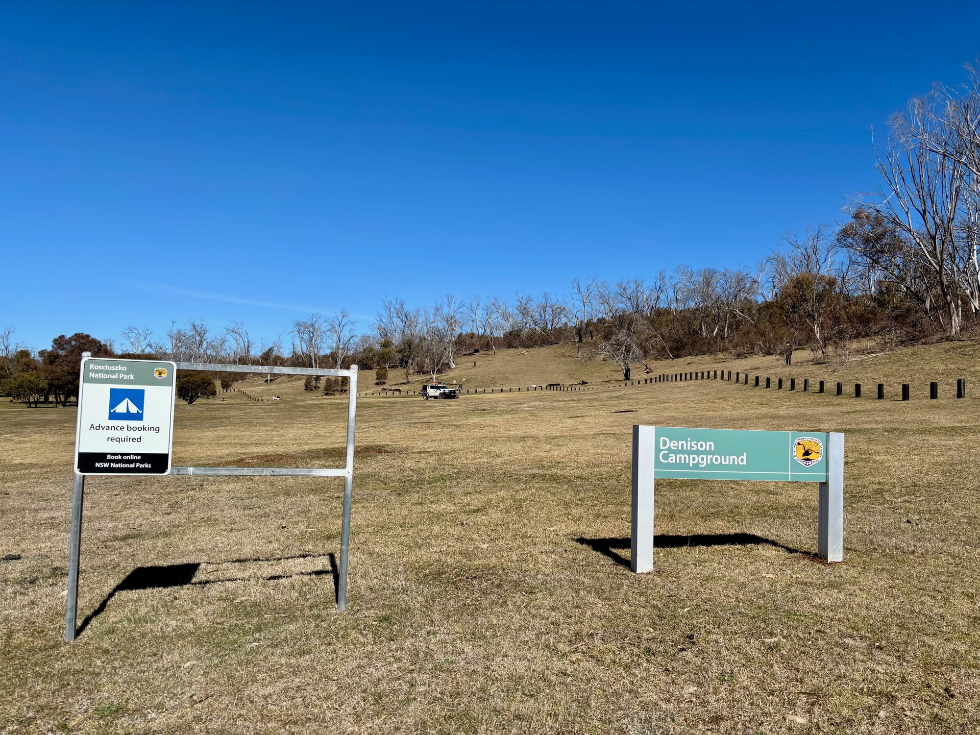 The Denison Campground sign with the advance booking notice next to it