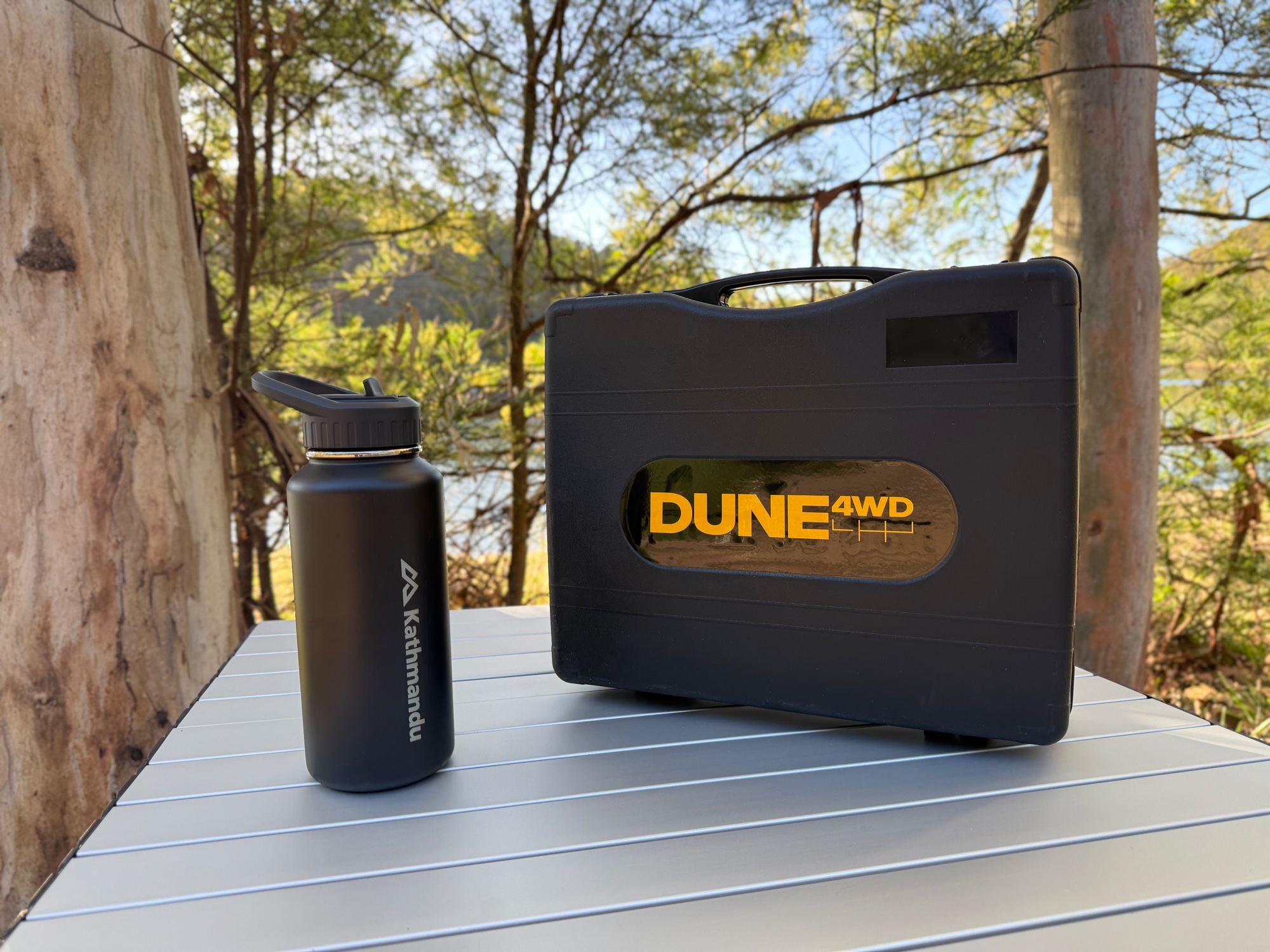 The Dune 4WD single burner stove in its hard grey carry case