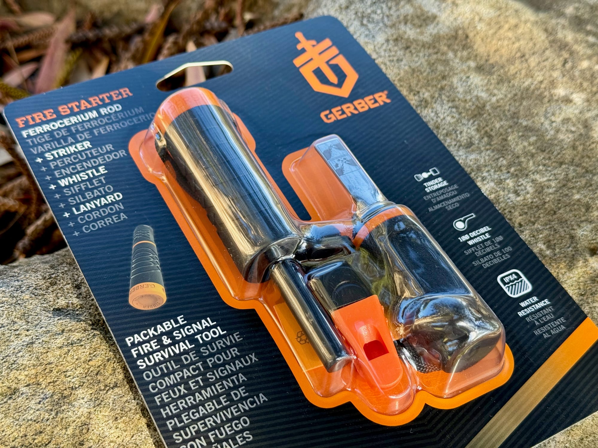 The Gerber Fire Starter in its packaging, with ferrocerium rod, striker, whistle and lanyard listed
