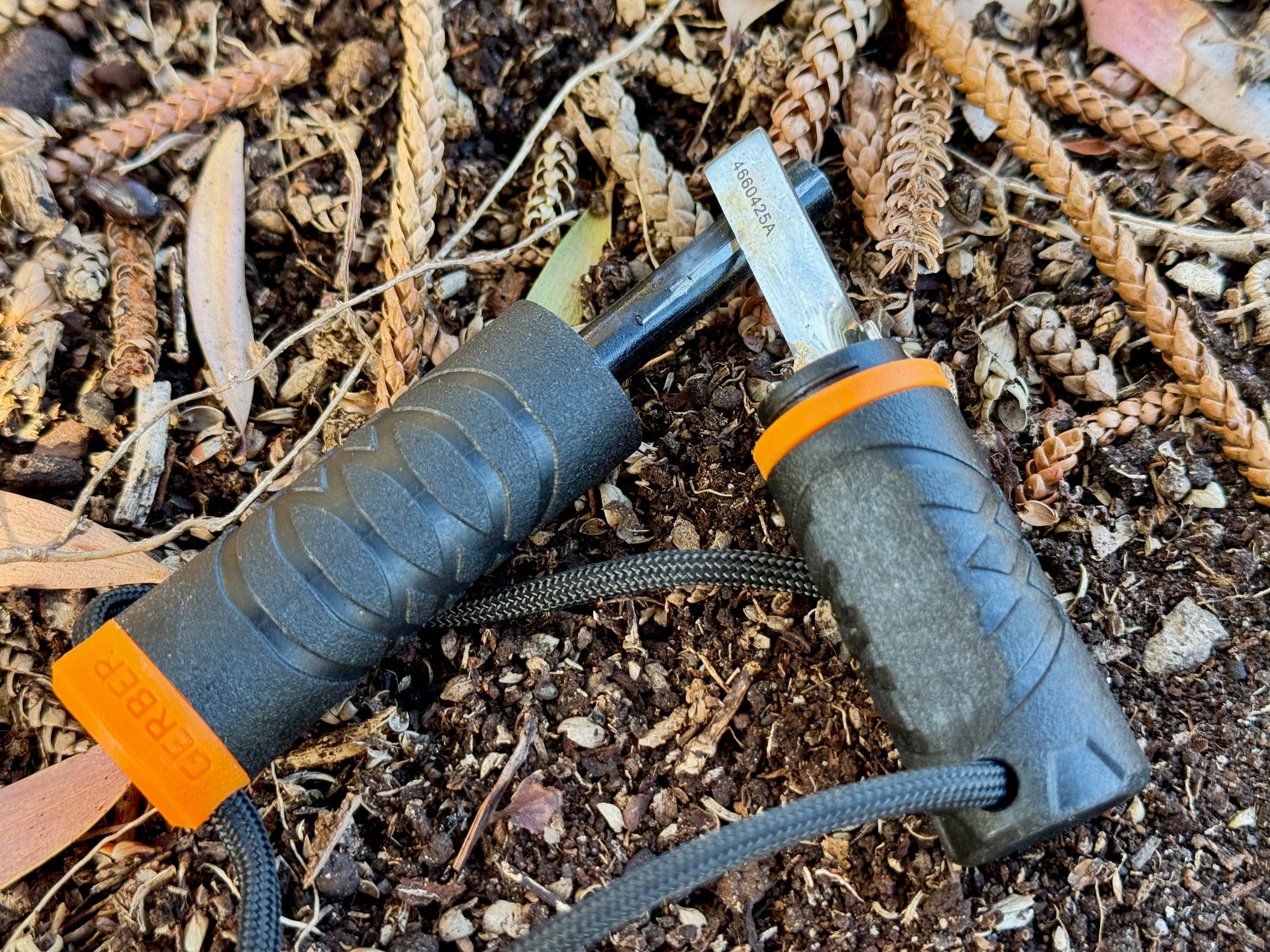 The steel striker and the ferro rod of the Gerber Fire Starter side by side