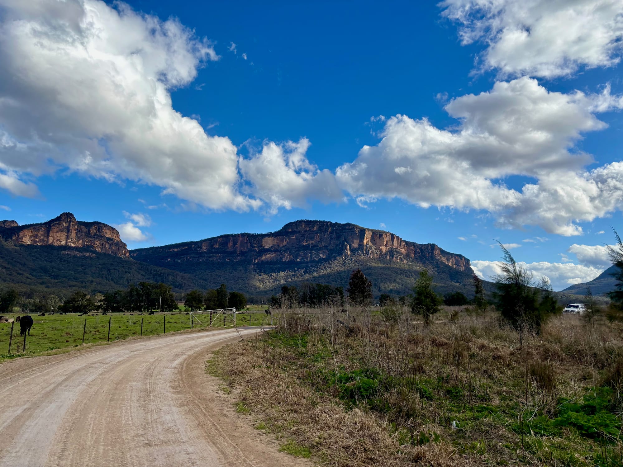 The gravel road into Glen Davis with the cliffs of the Capertee Valley ahead