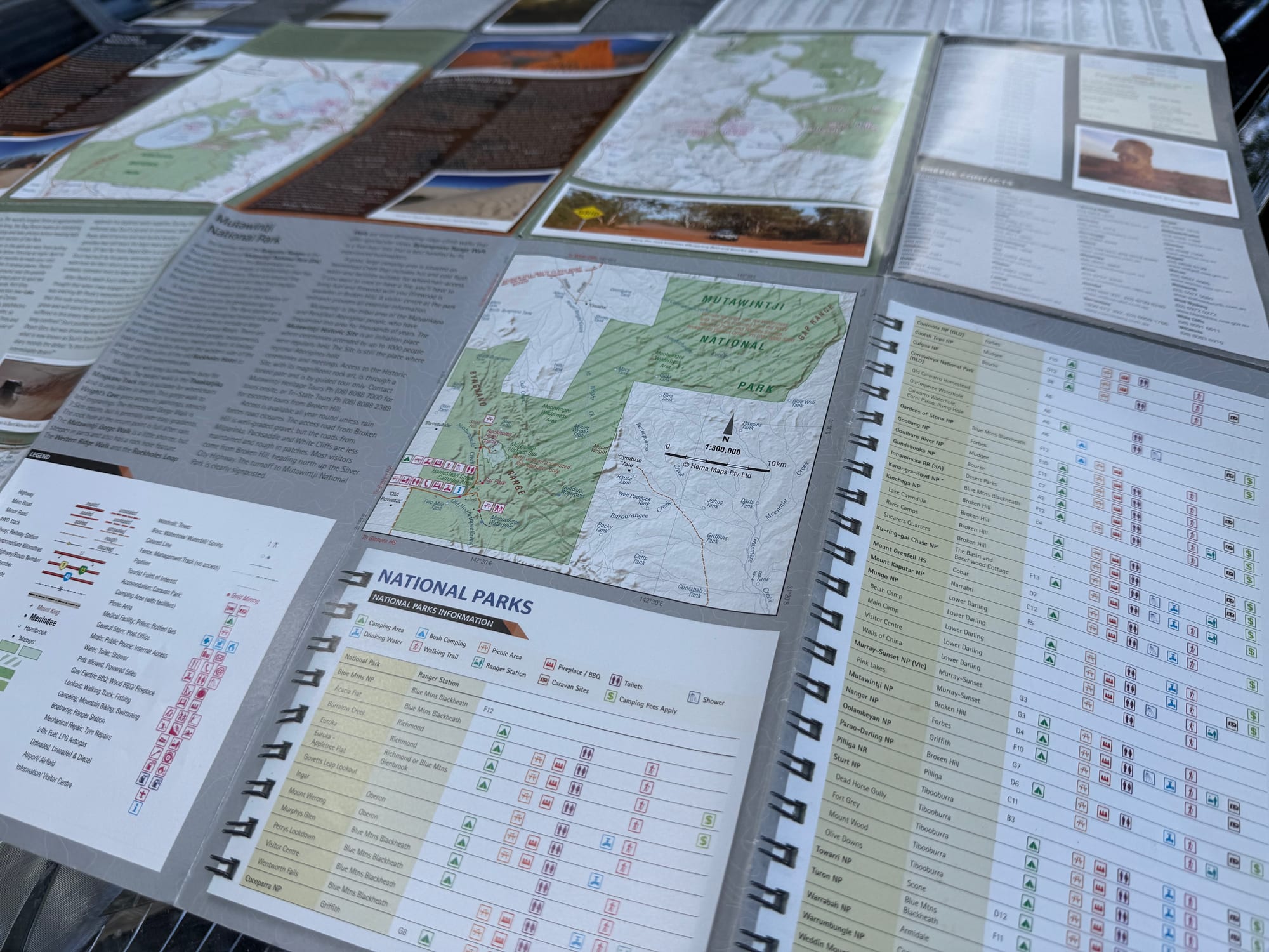 The back of the Hema Outback NSW map with national park maps and a table of camping areas