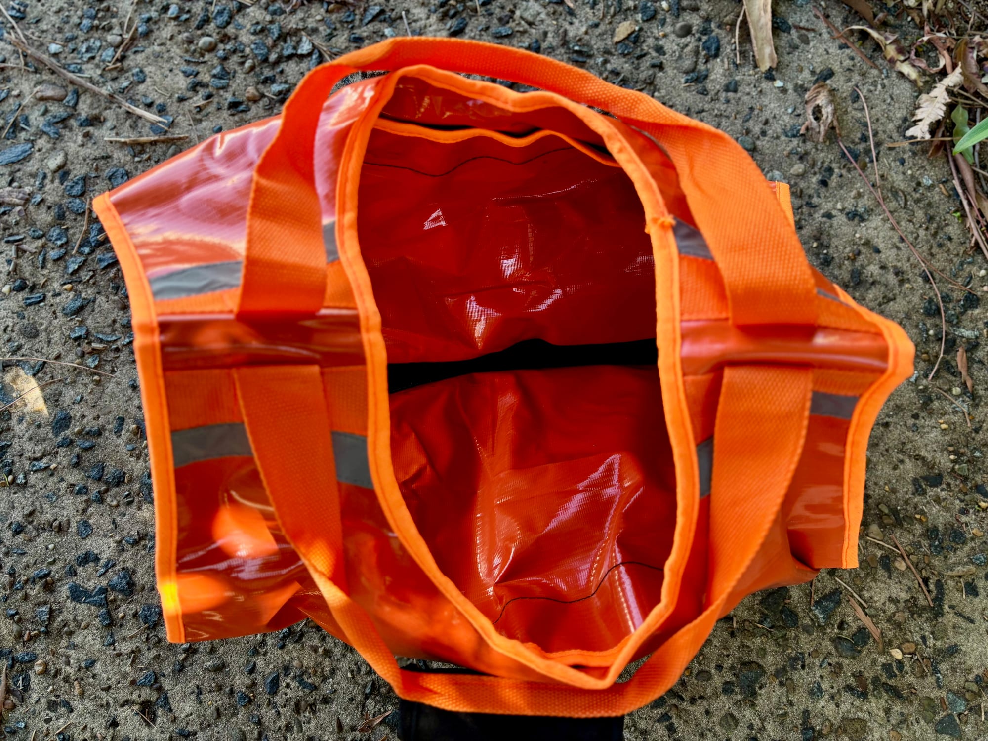 The open orange Hercules recovery bag from above, with its carry handles