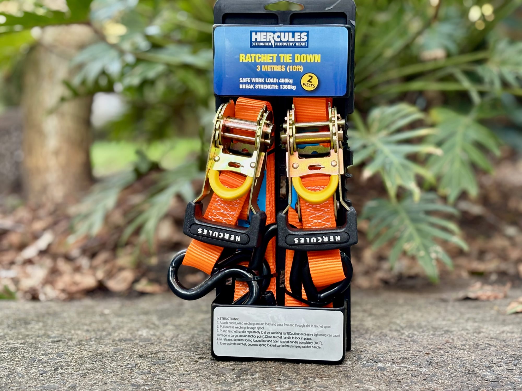 The Hercules ratchet tie-down two-pack on its card, standing on a path