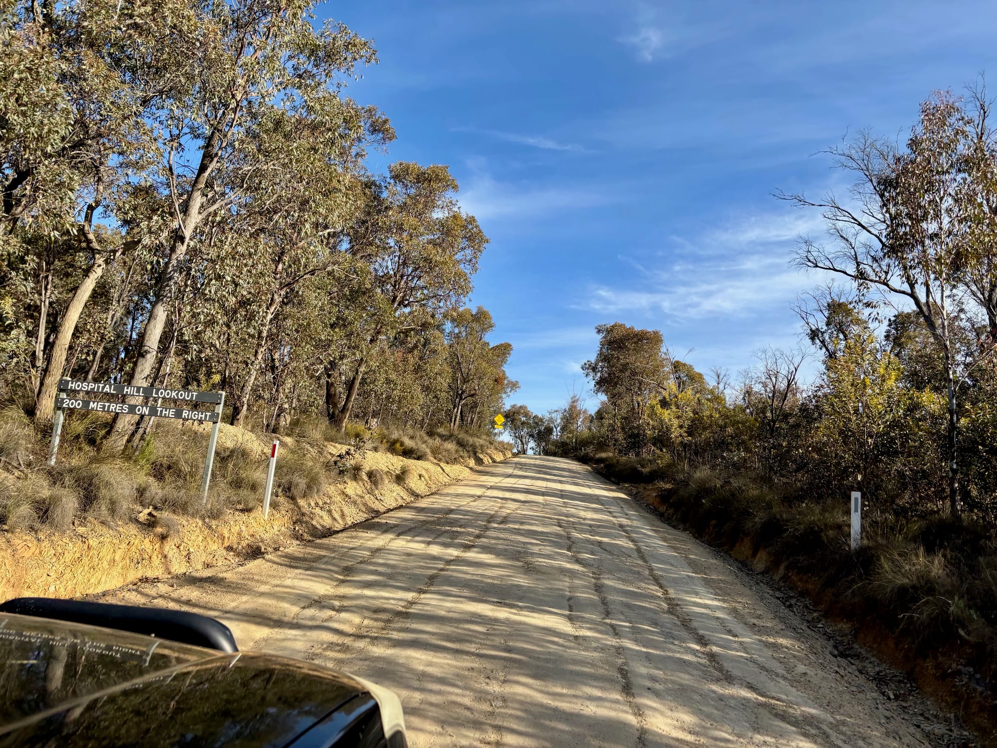The roadside sign for Hospital Hill Lookout on the gravel road: 200 metres on the right