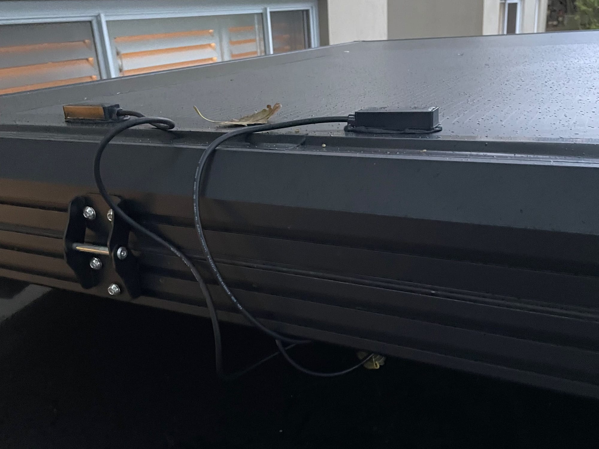 The solar cable running along the side of the rooftop tent