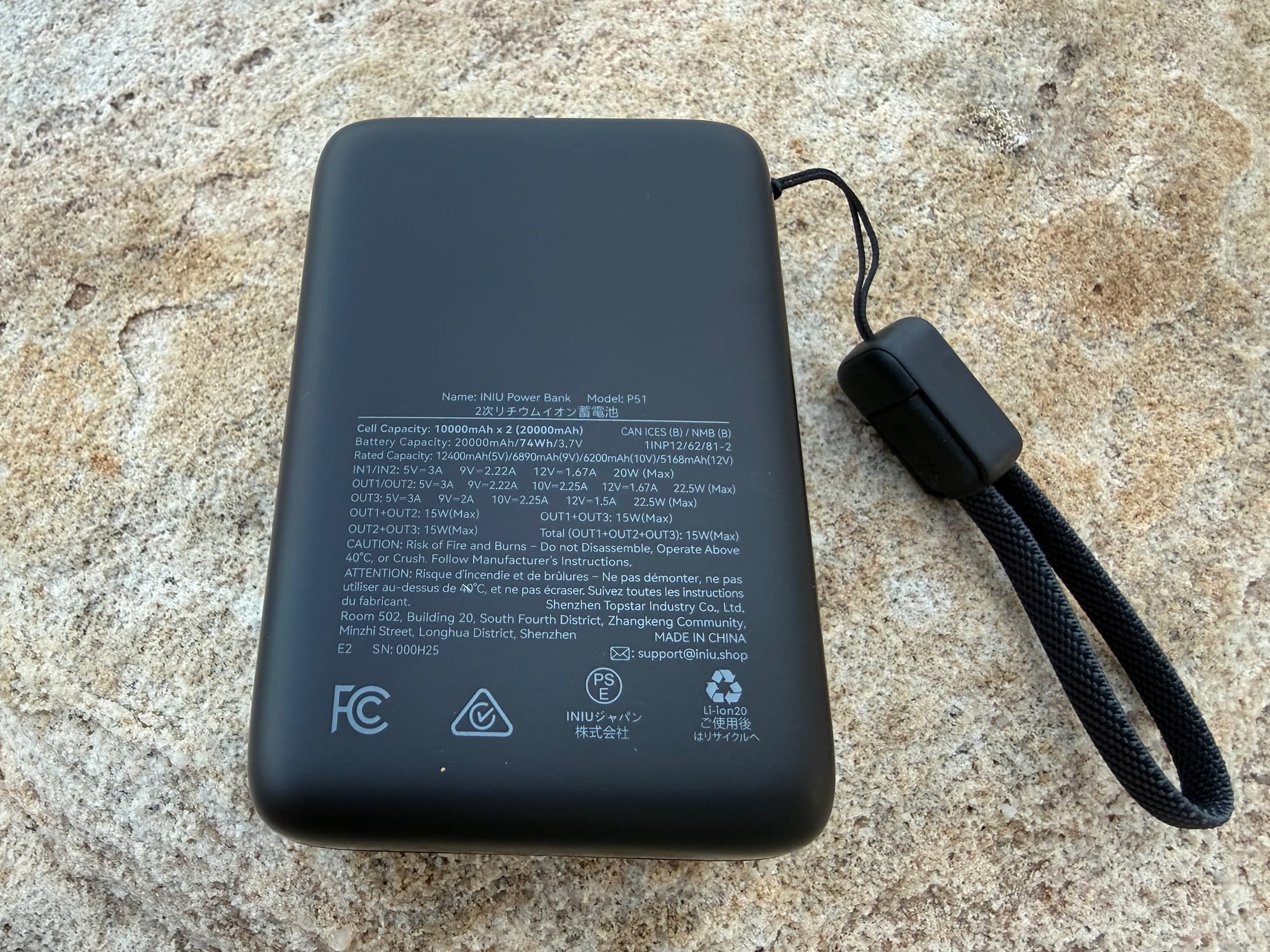 The spec label on the back of the INIU 20,000mAh power bank