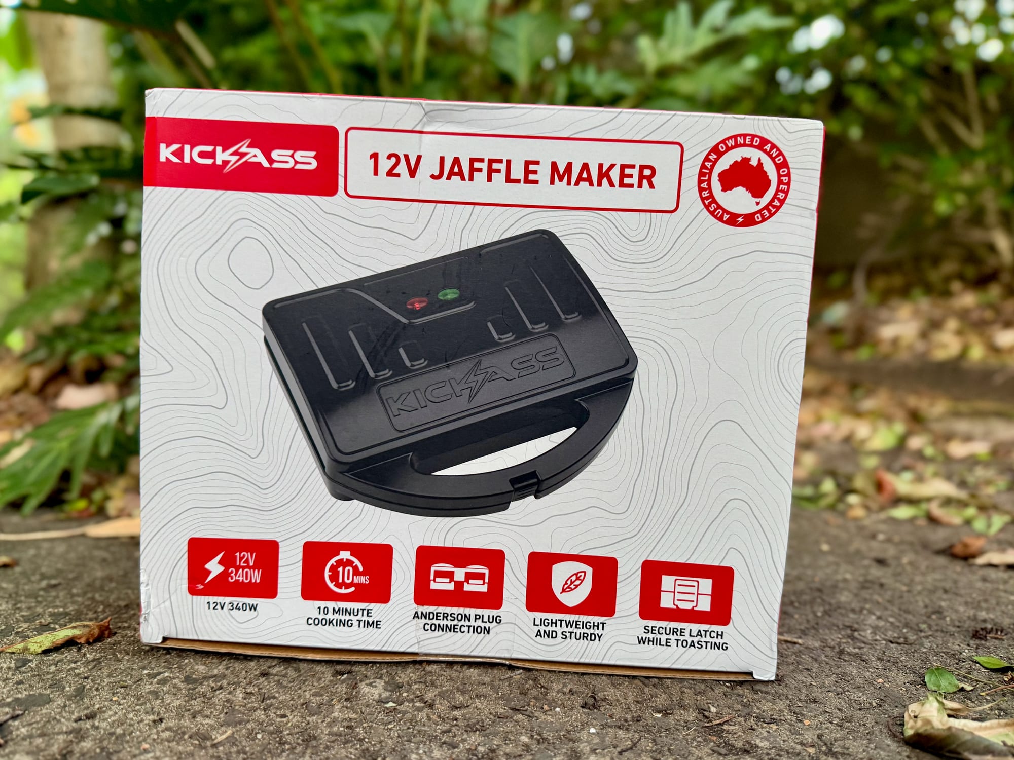 The KickAss 12V jaffle maker box showing 12V 340W, 10 minute cooking time and Anderson plug connection
