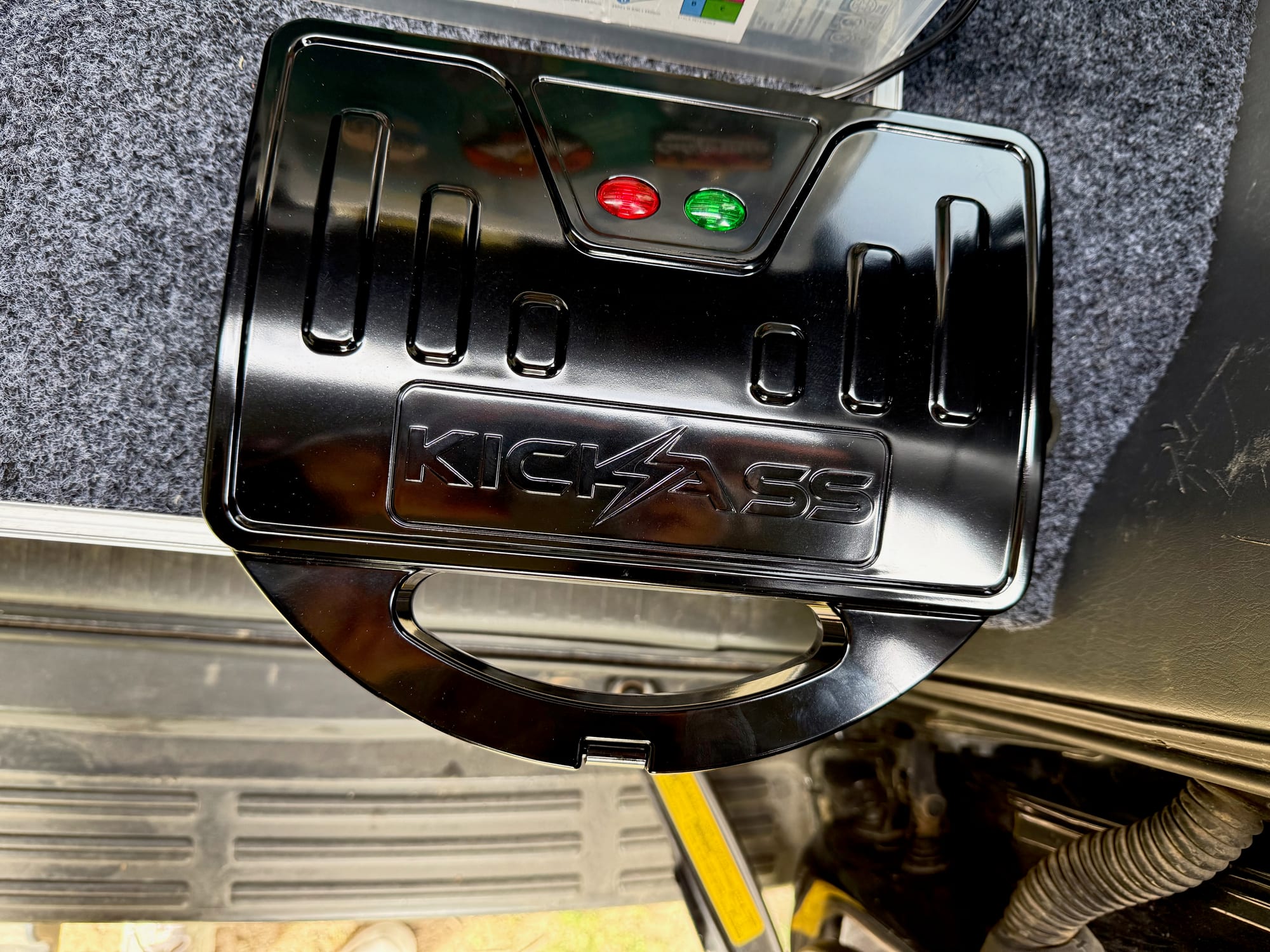 The closed KickAss jaffle maker toasting on the drawer slide, with its red and green lights on the lid