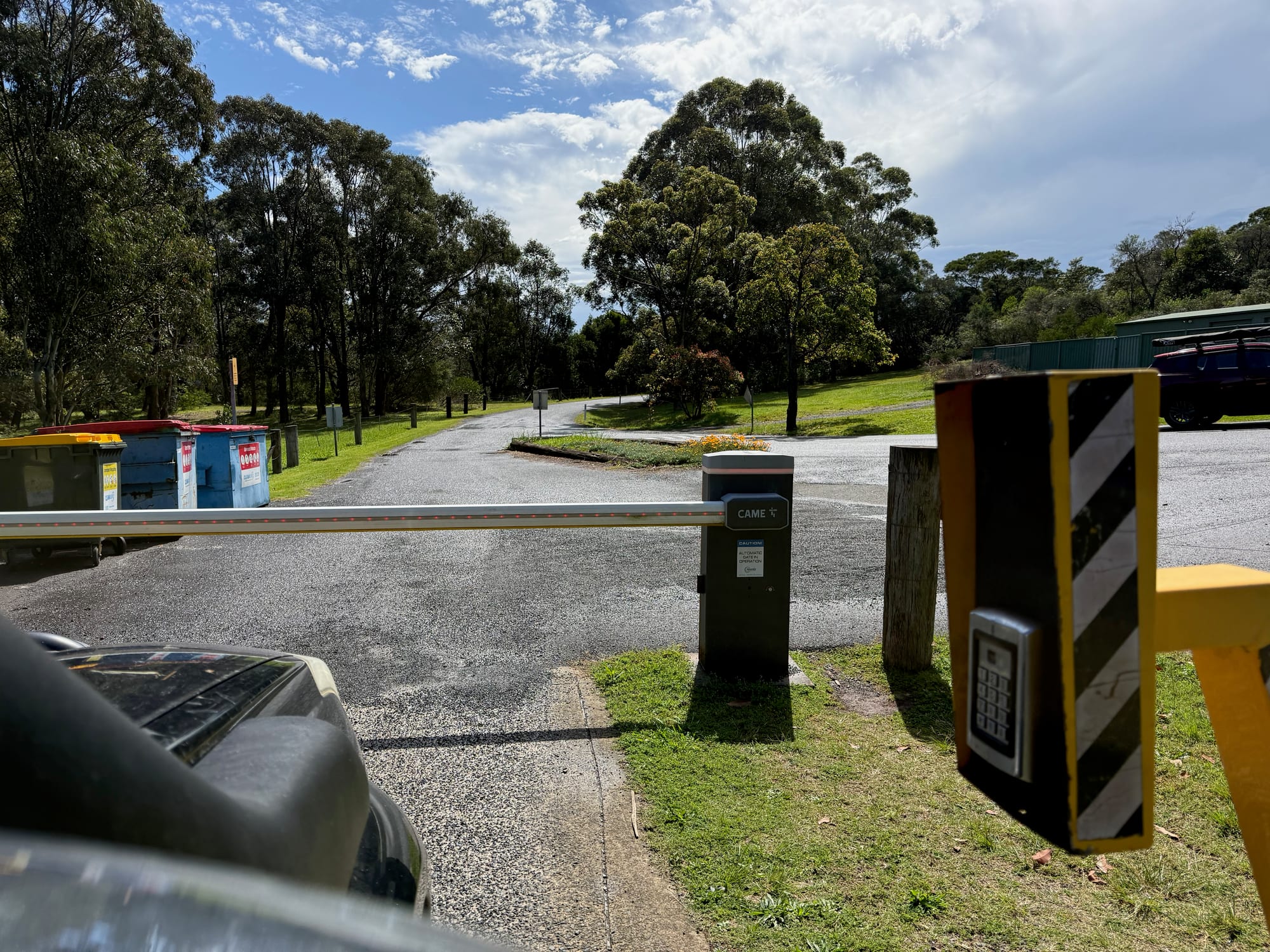 The boom gate with a keypad at the entry of Killalea Campground