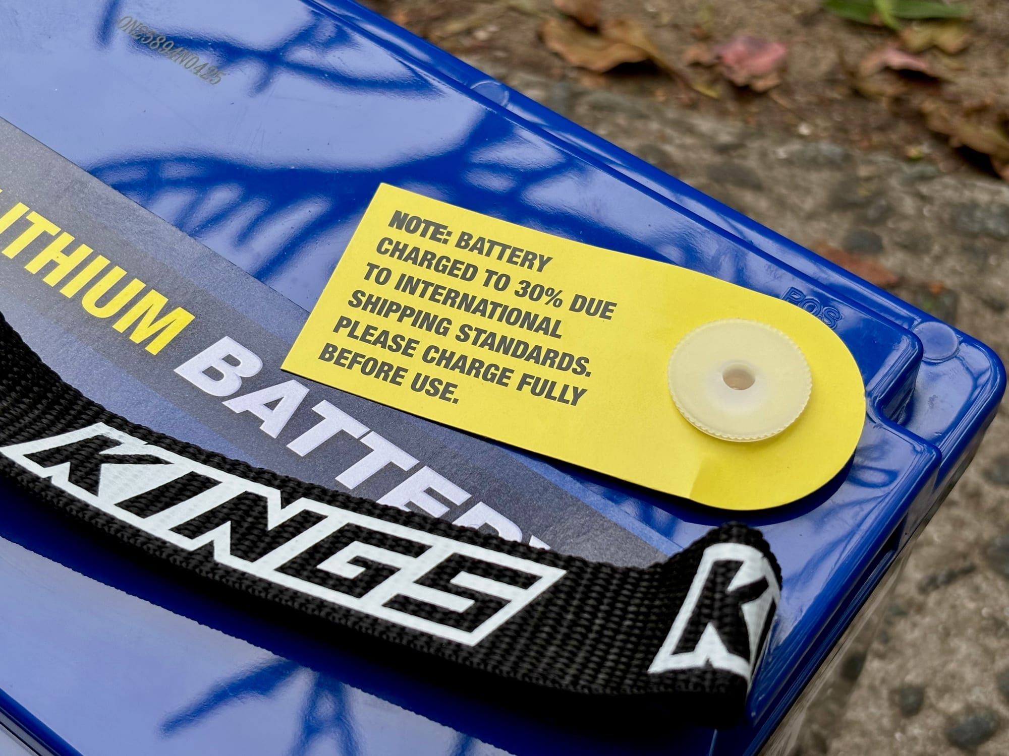The yellow sticker on top of the battery: charged to 30% for shipping, please charge fully before use