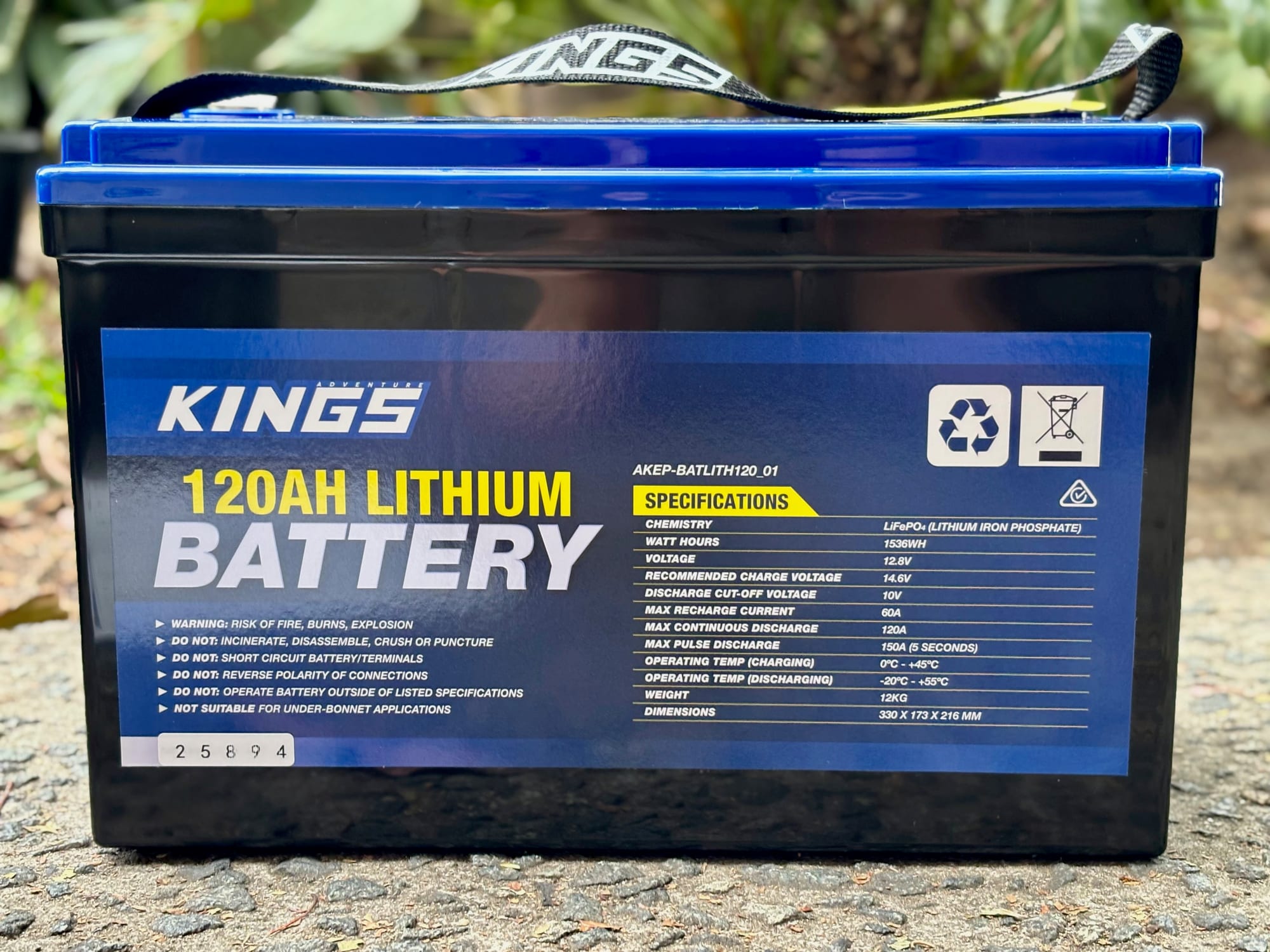 The front of the Kings 120Ah lithium battery with its label: the specifications and the safety warnings