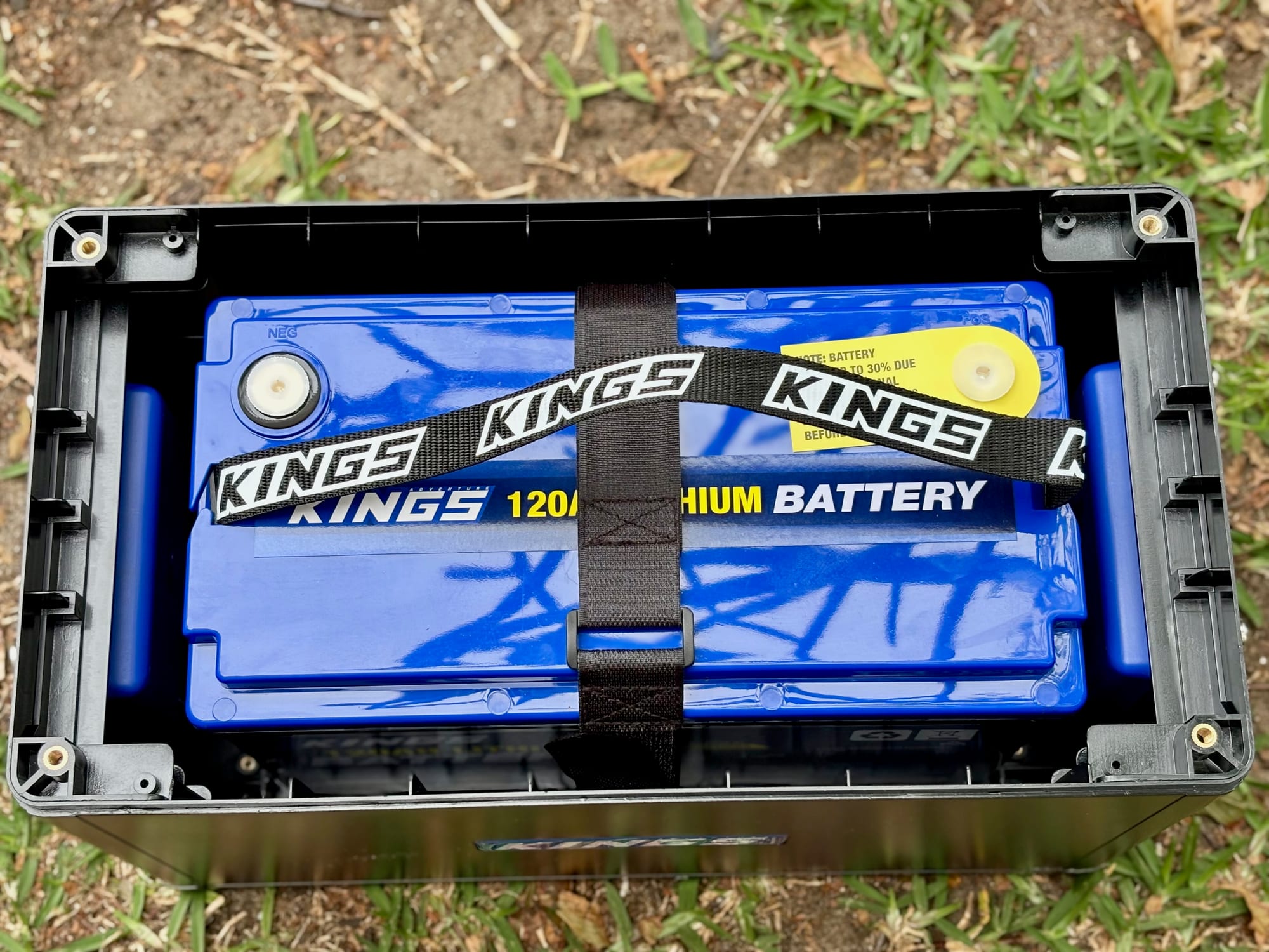 The Kings 120Ah lithium battery strapped down inside the bottom half of the BatBlock, on the grass