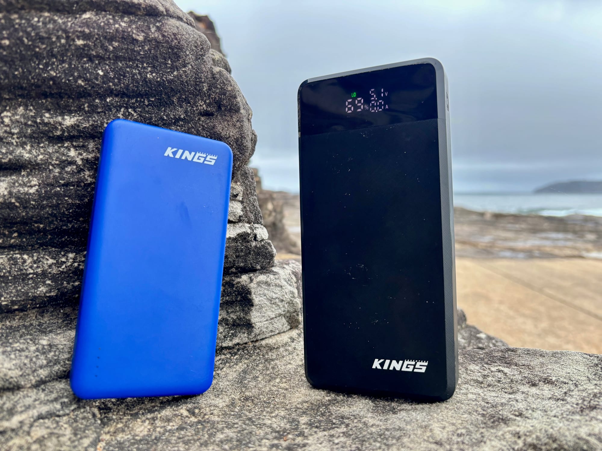The blue Kings 10,000mAh power bank next to the black Kings 20,000mAh power bank
