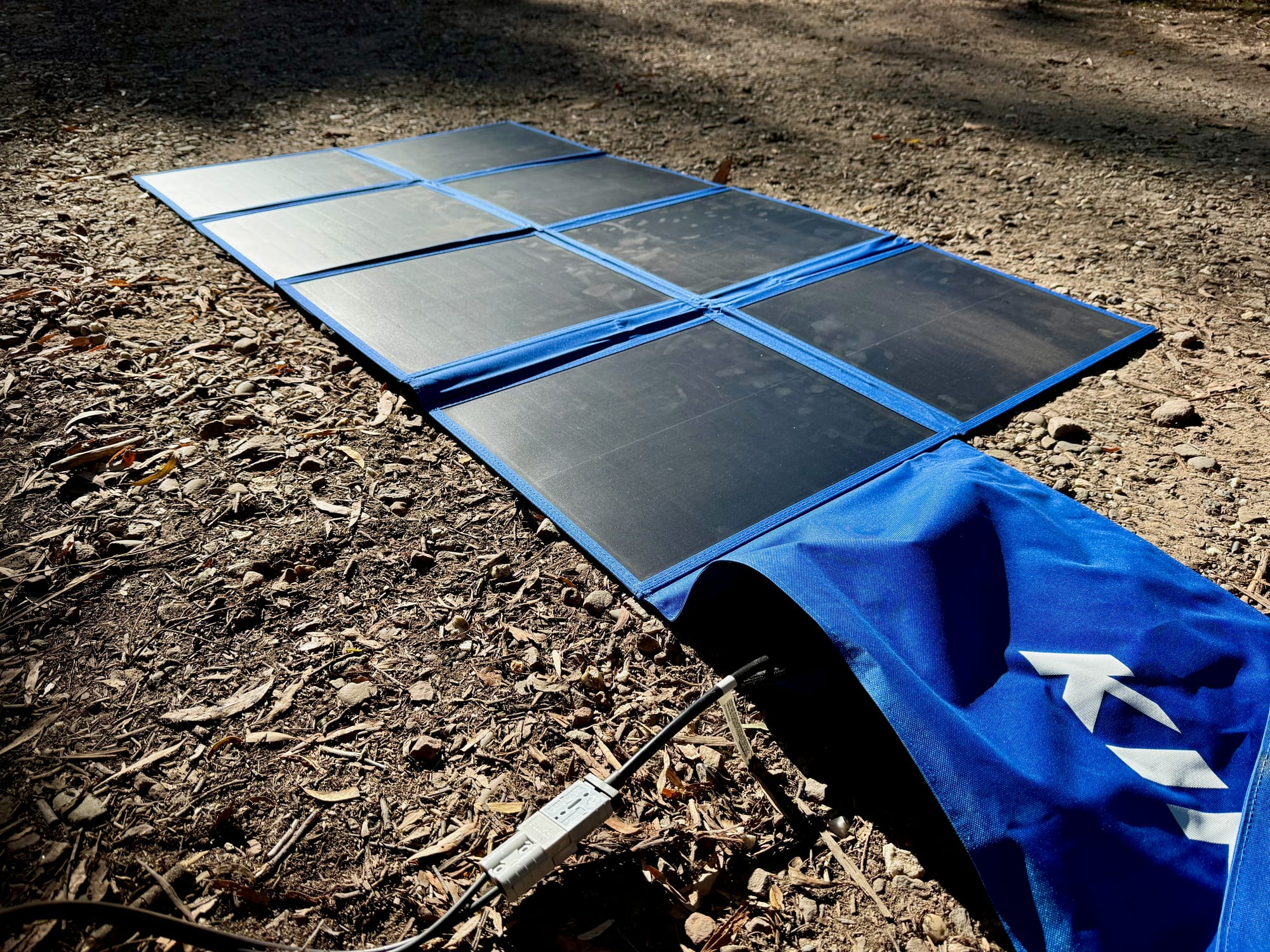The Kings 240W solar blanket unfolded on the ground
