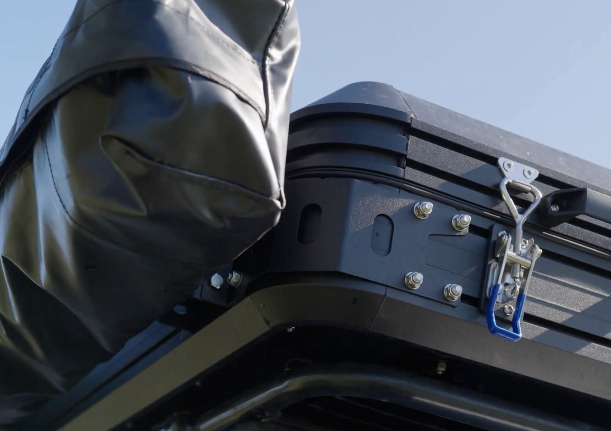 The awning bracket bolted to the side of the roof rack