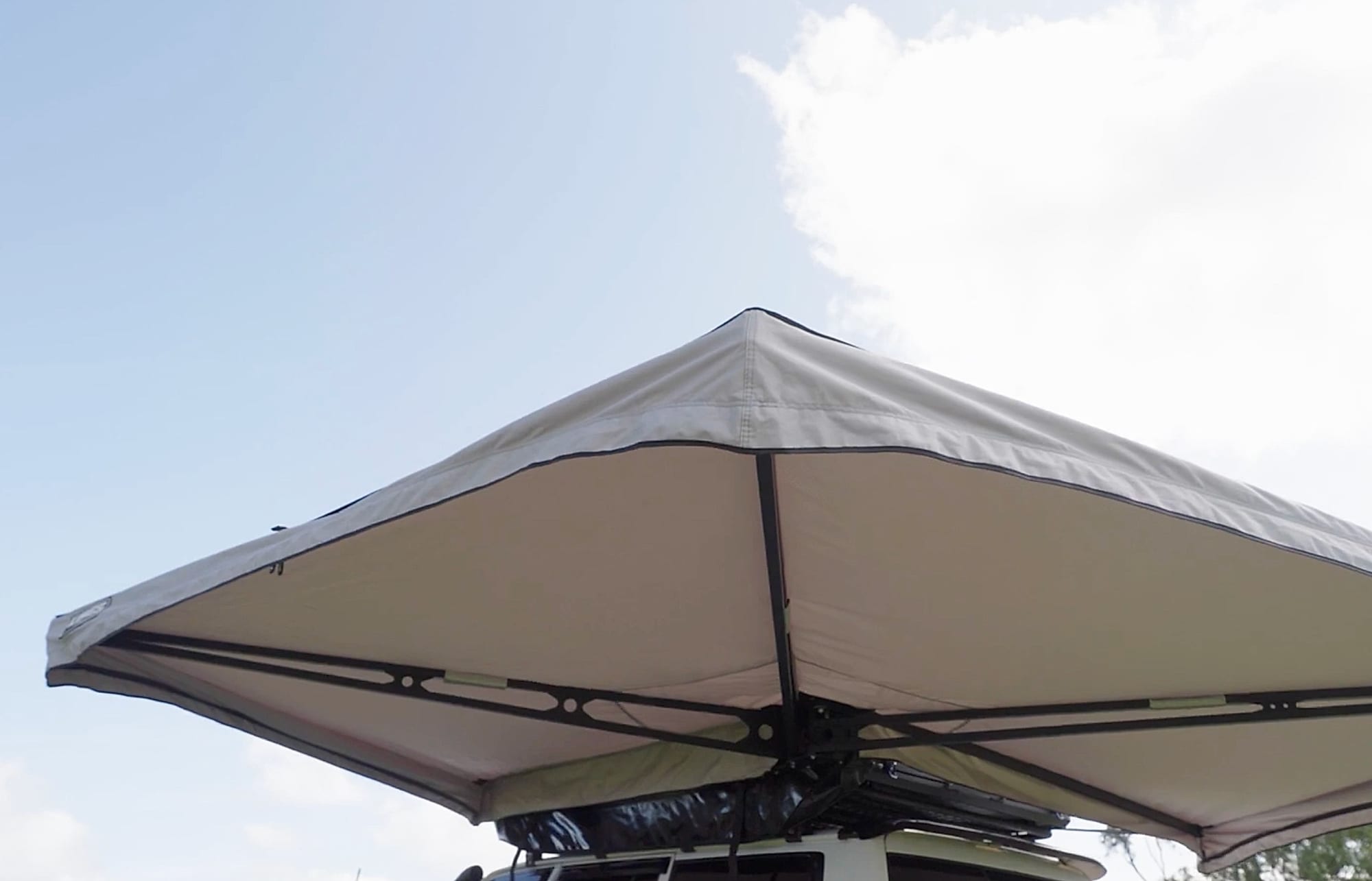 The grey Kings 270 Tourer awning opened out from a 4WD, seen from below