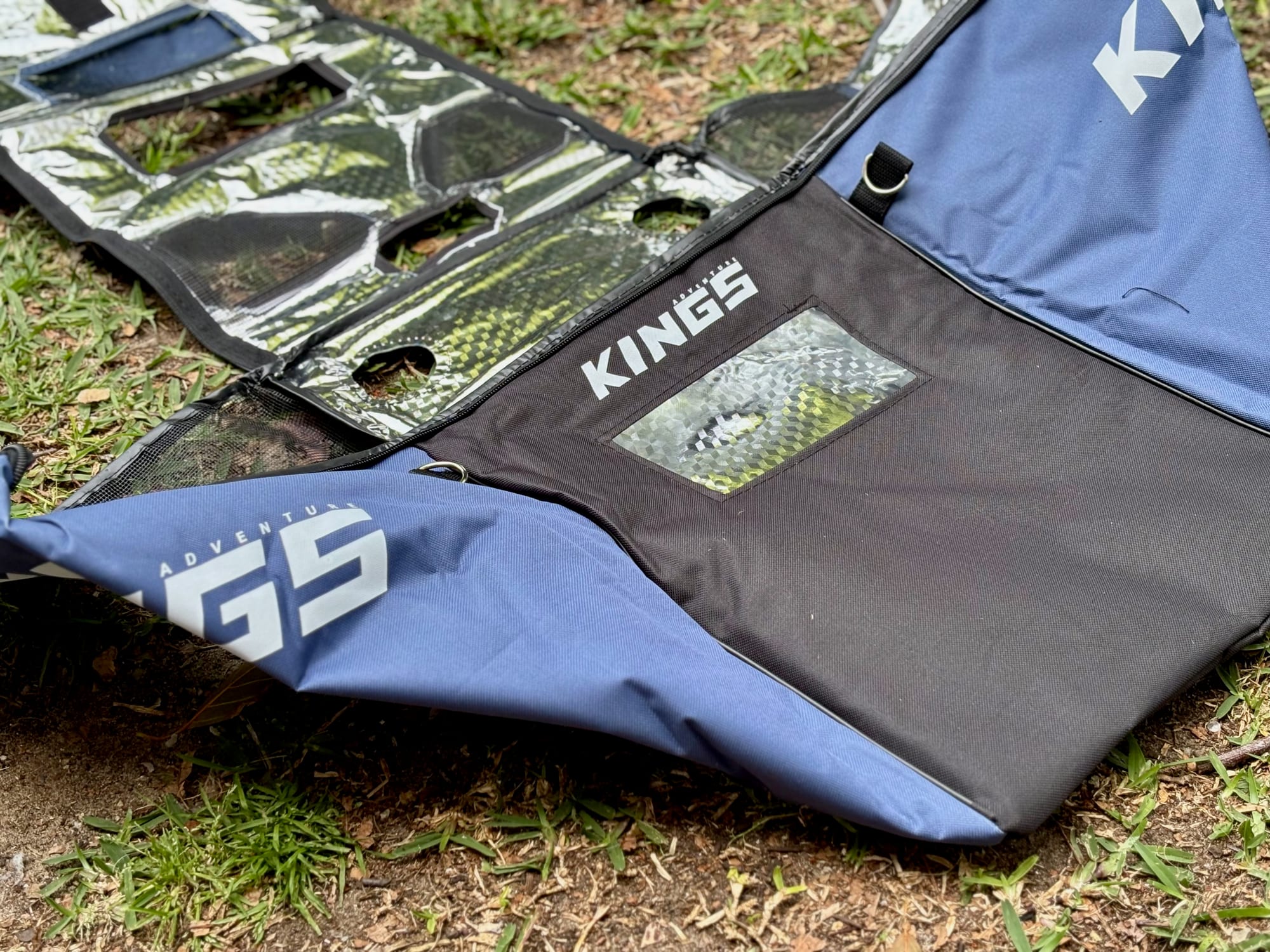 The Kings Escape 40 fridge cover laid out flat: the Kings logo, the clear display window and the silver insulated lining