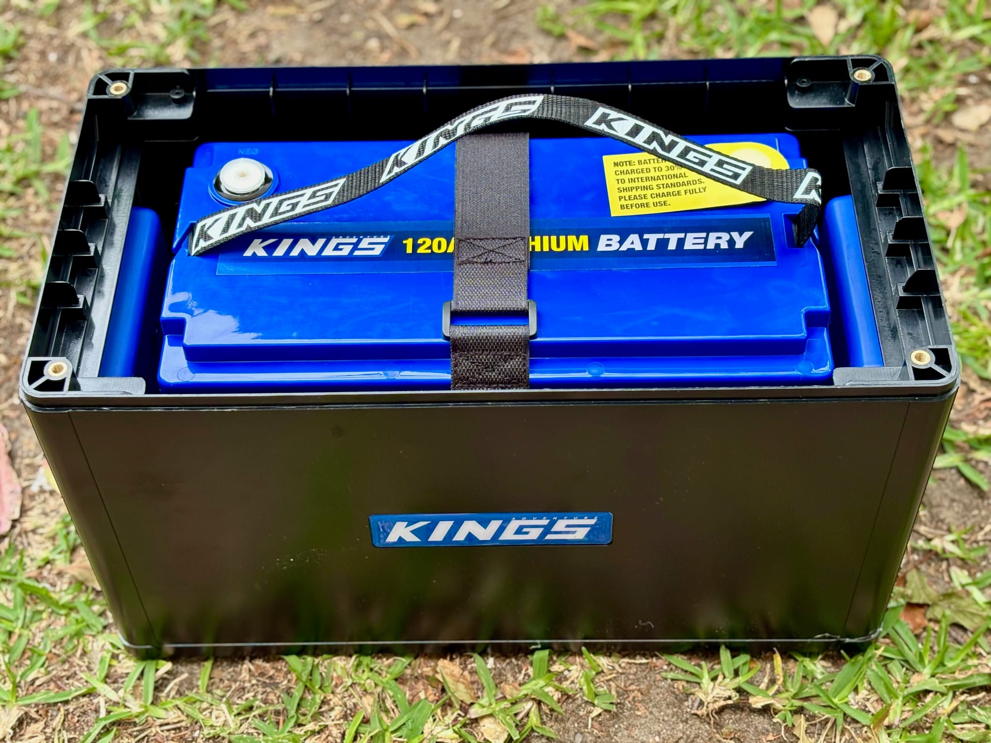 The Kings 120Ah lithium battery strapped down inside the bottom half of the BatBlock