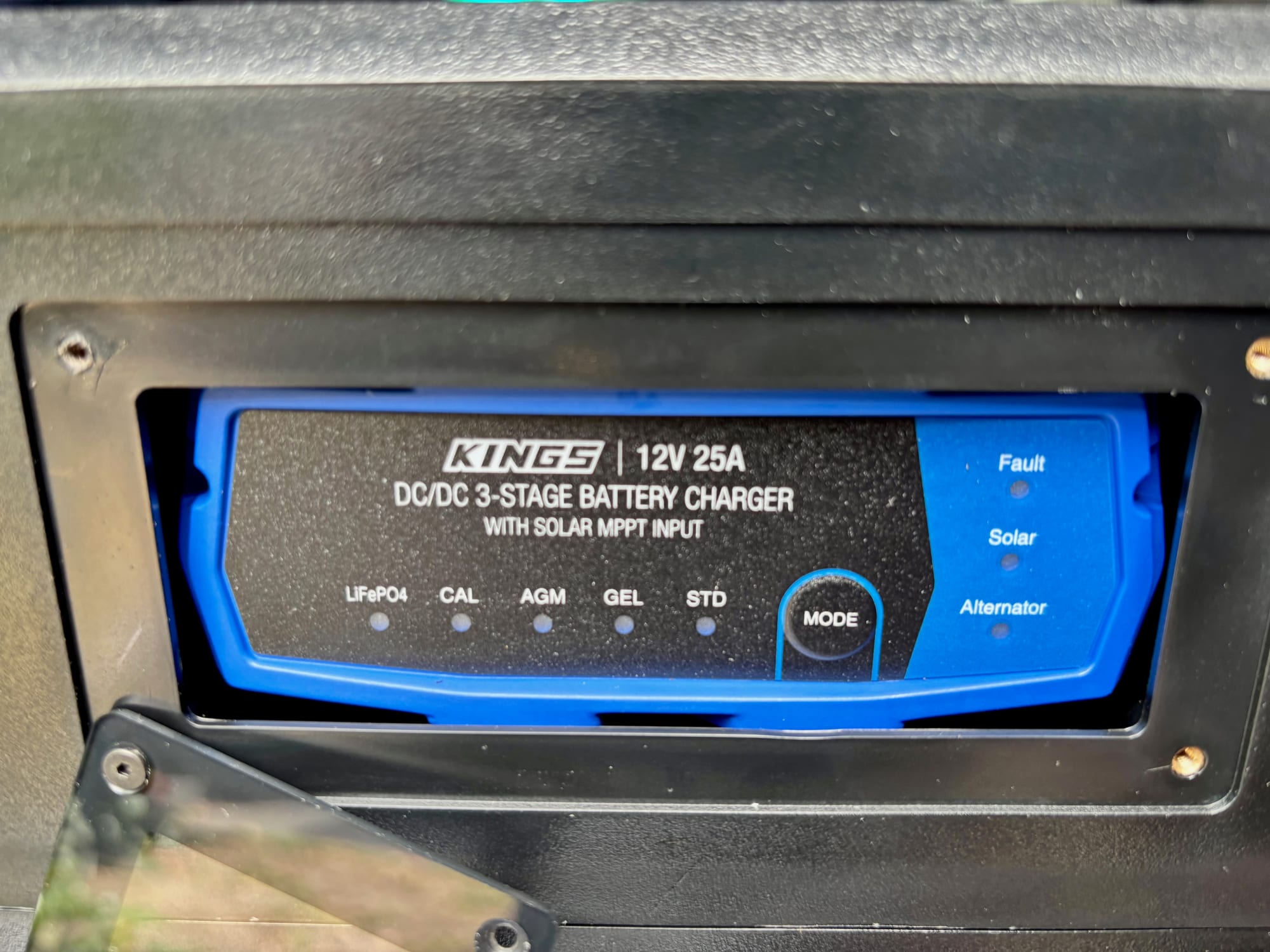 The Kings 12V 25A DC/DC charger on the front of the BatBlock, with the battery type lights and the Mode button
