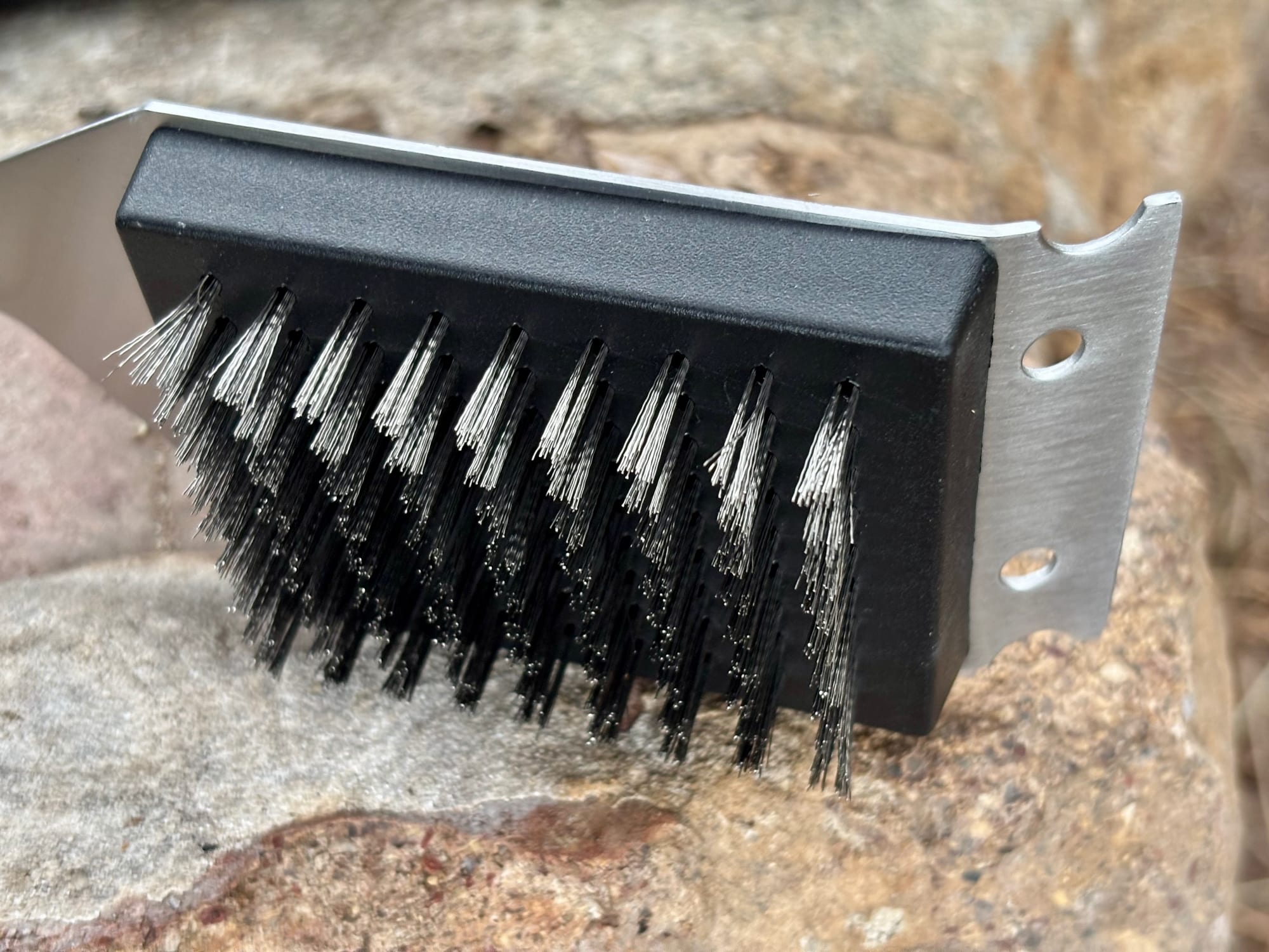 The wire bristles and the steel scraper edge of the Kings BBQ brush