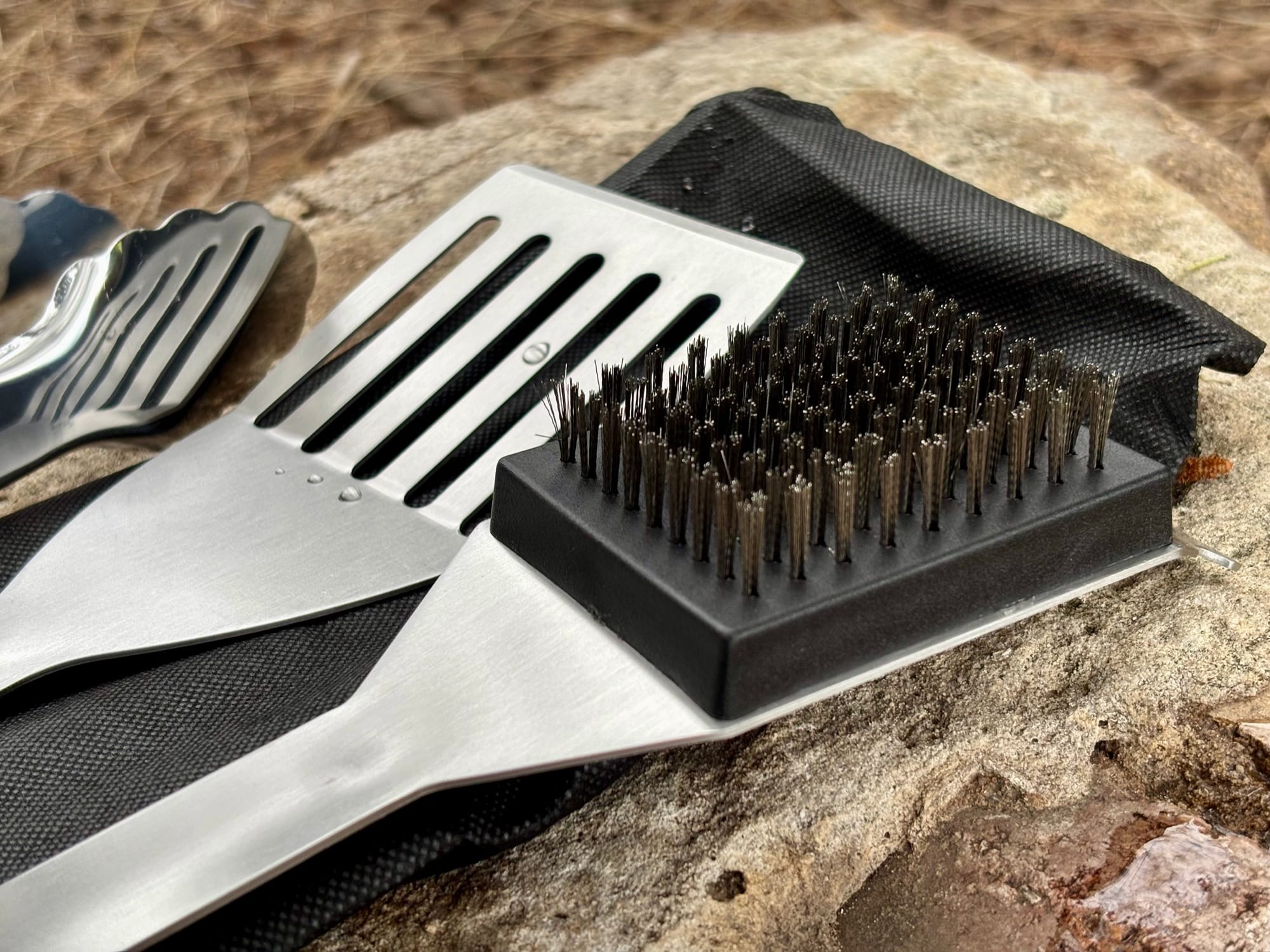 The slotted spatula blade and the brush head of the Kings BBQ Tool Set