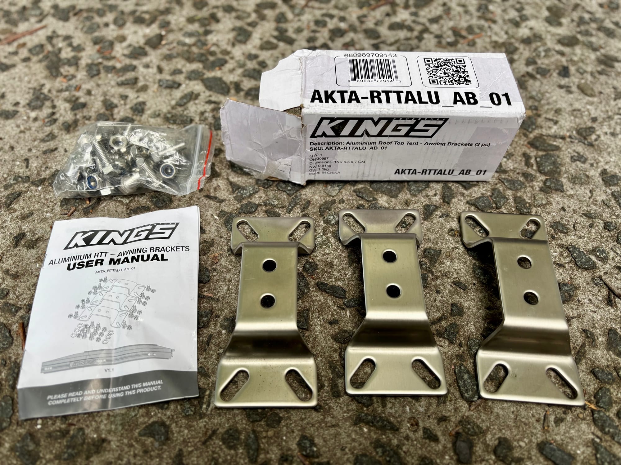The Kings awning bracket kit box, user manual, bag of bolts and three stainless brackets