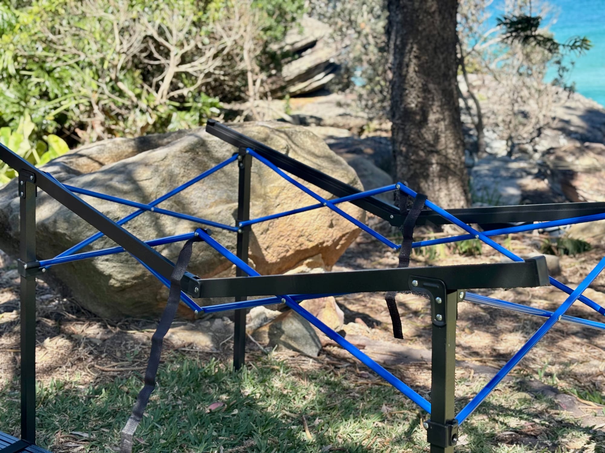The Kings Large table’s steel frame unfolded, without its top
